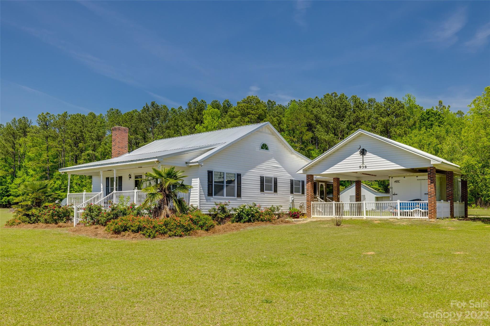 A little over an hour's drive from Charlotte will place you on this gorgeous country estate of nearly 15 acres! With fertile ground, a small forest, serene pond and more.  A barn/workshop that is great for a hobby and more.  The home, wrapped in rich, adorning landscaping that compliments, a spacious front porch is just the spot for a slow rock and tall glass of tea while overlooking your land. Head to the sunroom and bask in the warmth of natural light. Indoors, the beauty and comfort continues with an eye-catching stone fireplace. The kitchen offers rich, Red Oak cabinets, granite counters that are absolutely stunning, and a stone façade front bar area. This cozy country home won't disappoint with it's three bedrooms and spacious closets. Home is located within 6.2 miles from Elite Motocross Training Facility (Club MX) Come see what this gorgeous space with its expansive views has to offer! Make your appointment today!