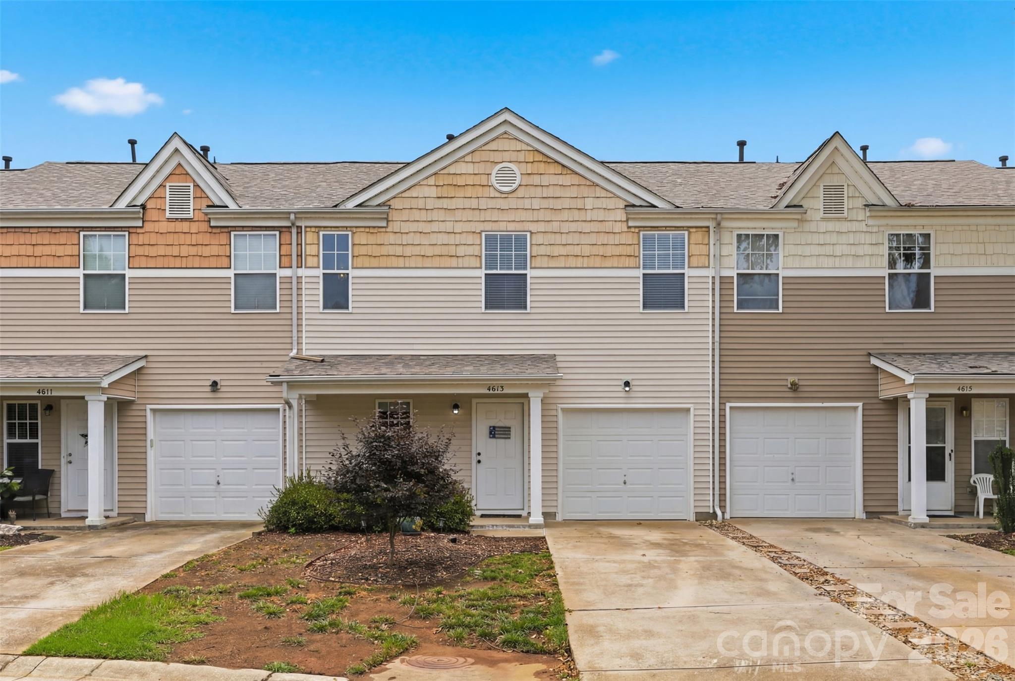 Meticulously maintained and move-in ready, this charming townhome offers the perfect combination of comfort, convenience, and low-maintenance living! The main level features a bright, open floor plan with a spacious living areas that flow seamlessly into the kitchen, complete with abundant cabinet space—ideal for everyday living and entertaining. Upstairs, you'll find the primary suite is conveniently with a walk-in closet and an en-suite bath with a large garden tub and separate shower, a generously sized second bedroom, the laundry closet and the second full-bath.  Enjoy peace of mind with a brand-new roof (March 2025) and a full HVAC system (2020) with gas heat. This home offers a 1-car attached garage, a covered front porch and a back patio. This home is conveniently located to shopping, dining, medical and I-77!