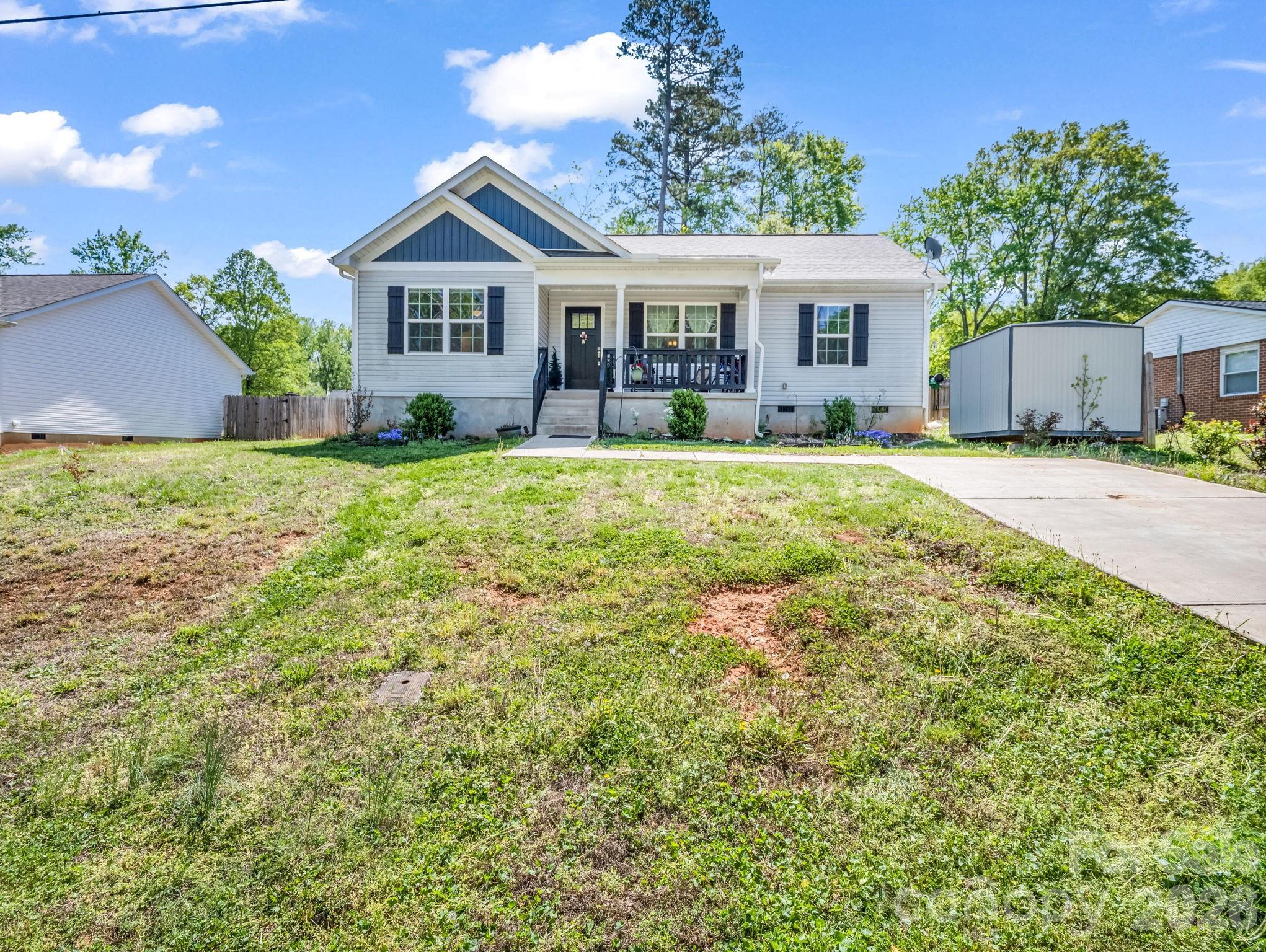 Open ranch-style home with 3 bed/2 baths. A bright white kitchen with Shaker-style cabinets, stainless steel appliances, vaulted ceiling, and granite countertops. LVP flooring throughout the main areas and carpet in bedrooms. Split bedroom plan with a large primary bedroom and attached full bath with dual sinks and a walk-in shower. Two additional bedrooms with shared bath. Situated on a manageable 0.25-acre lot, this property offers just the right amount of outdoor space for relaxing or entertaining without the burden of extensive upkeep. Enjoy the convenience of being just minutes from downtown Forest City, the Thermal Belt Rail Trail, local shops, dining, and more. Whether you're a first-time buyer, downsizing, or looking for a move-in ready home with modern features, this one checks all the boxes!