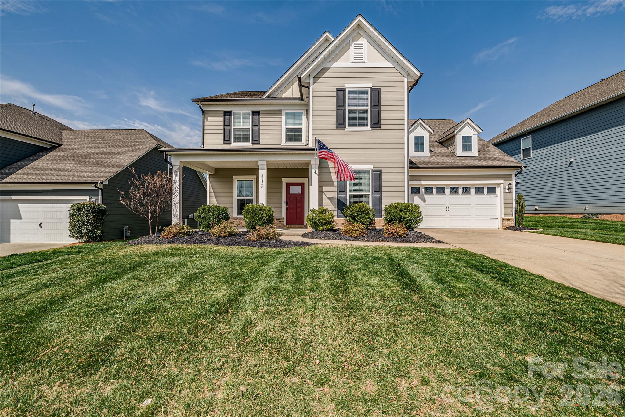 Nestled in the McCullough community of Fort Mill, this beautifully appointed home boasts an open floor plan that seamlessly blends everyday living with entertaining guests. The kitchen is a culinary haven, equipped with a wall oven and microwave, gas cooktop, granite countertops, a tile backsplash, stainless steel appliances, a spacious island with seating, a walk-in pantry, and a butler’s pantry that transitions into the formal dining room. The expansive family room exudes comfort, featuring a stone-stacked fireplace and a wall of windows that flood the space with natural light. Step outside to relish the outdoors with two patio areas overlooking the fenced yard. One of the few homes that face the community park offers peaceful views from the front porch. On the main level, there’s a dedicated home office, a mud room that serves as a home planning center, and a drop zone with cubbies and a coat closet. Upstairs, you’ll find the primary bedroom, a luxurious retreat with a spacious bath, a large walk-in closet, dual vanities, a garden tub, and a separate shower. Three additional bedrooms and a bonus room, which could also serve as your fifth bedroom, complete the upstairs suite. The laundry room is conveniently located on this level and features cabinets. Finally, a walk-in storage area provides ample space for seasonal items.