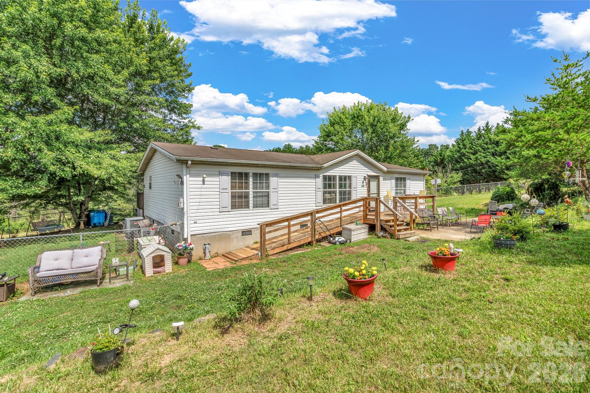 Opportunity awaits in desirable Alexander! Nestled just minutes from both Weaverville and downtown Asheville, this property offers the perfect blend of convenience, usable land, and potential. Situated on a recently subdivided parcel, the home features a spacious layout ready for your personal touches and updates.

Outside, you'll find a fully fenced front yard, an expansive driveway with plenty of parking, and a large above-ground pool with surrounding deck that could use some repairs or replacement. This is perfect for enjoying warm summer days. The generous yard provides room for gardening, recreation, pets, or future improvements, all surrounded by the peaceful setting that makes Alexander so desirable.

The property is located in an open-use area, offering flexibility without HOA restrictions. A simple road maintenance agreement is in place, and a shared well agreement is currently being finalized.

The home could benefit from some TLC and cosmetic updates, making it an excellent opportunity for buyers looking to build equity or customize a home to their taste. Whether you're searching for a primary residence, investment property, or a place to enjoy the outdoors with room to grow, this property offers outstanding potential in a highly convenient location.