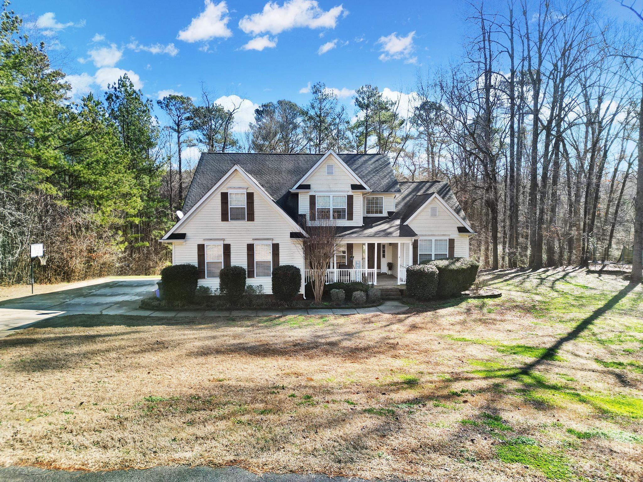 Nestled on an expansive 3.3-acre parcel of land, this exceptional residence offers the perfect blend of tranquility and modern living. The sprawling property is enveloped by a lush and private wooded landscape, providing an idyllic retreat from the hustle and bustle of daily life. The 4-bedroom, 2.5-bath home spans an impressive 2900 square feet, boasting a harmonious fusion of comfort and sophistication. The property is at the end of a cul de sac lot and there is nothing but privacy, woods and wide open spaces behind this home. The oversized extra private deck overlooks the backyard which leads to the private woods complete w hiking trails. The exterior is a tasteful combination of classic and contemporary architecture, with a neutral color palette that complements the natural surroundings. Large windows strategically placed throughout invite abundant natural light. Primary Bedroom en Suite is on the Main & the home is priced to sell quickly, but it will NOT LAST!! DO NOT WAIT!!
