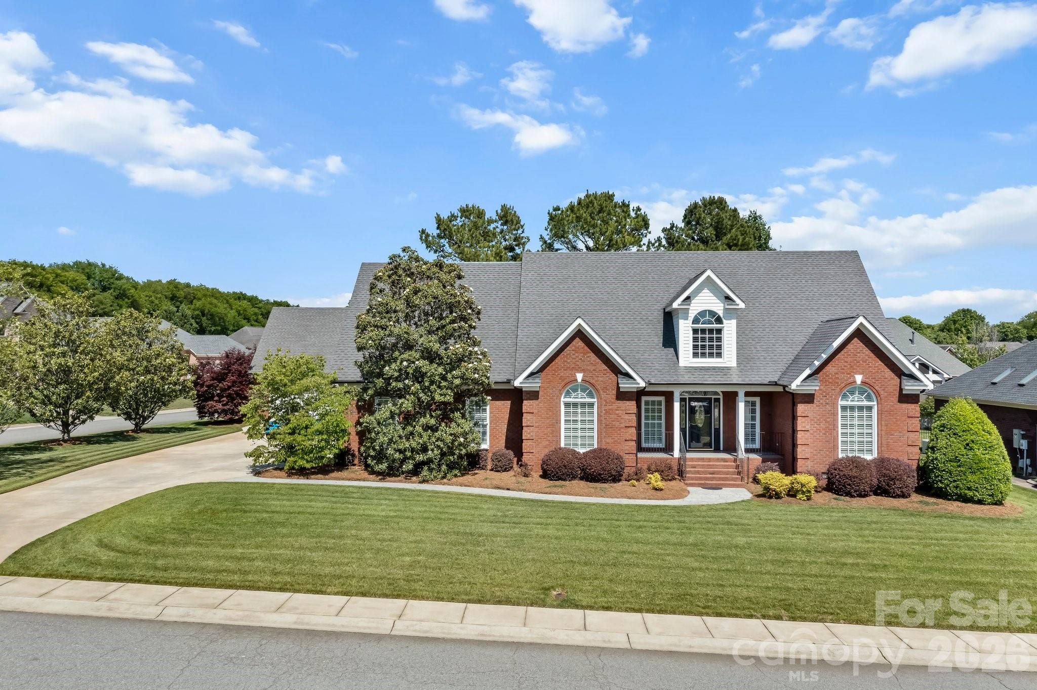 Offering $10,000.00 for the buyer's closing costs with an acceptable offer! For the first time offered, this custom-built builder’s personal residence showcases exceptional craftsmanship, thoughtful upgrades, and meticulous maintenance throughout. Located in desirable Morris Glen, this beautifully maintained home offers approximately 3,477 total finished square feet, including a detached garage apartment, providing flexibility for multigenerational living, guests, or private workspace needs.
Situated on a meticulously landscaped corner lot, the full tumbled brick exterior with elegant coin accents creates timeless curb appeal, complemented by palladium front windows, a welcoming front porch, and a rear patio finished with flake epoxy coating and silica for added traction and durability. The fenced backyard is designed for outdoor enjoyment with natural gas plumbing already in place for your grill, mature magnolia, Japanese maple, crape myrtle, and dogwood trees, plus a well ready for a full-yard sprinkler system. Additional exterior features include underground utilities and downspouts, a 50-year architectural roof with recently replaced boots to help eliminate leak risks, and updated exterior locks and handles within the past year.
Inside, the main home features an open split-bedroom floor plan accented by impressive 8-foot baseboards, plantation shutters throughout, and extensive recent updates including new pet-friendly carpet and pad, new tile flooring, new toilets, and all-new stainless steel appliances. The grand entryway welcomes you with beautiful hardwood floors, decorative plant shelves, and a foyer ledge featuring a light switch-controlled electrical outlet perfect for seasonal décor or accent lighting.
The dining room offers hardwood floors and a vaulted ceiling, creating an elegant setting for entertaining. The spacious kitchen features granite countertops, all-new stainless steel appliances, and excellent flow into the main living areas. The great room is truly the centerpiece of the home with custom built-ins, a traditional masonry fireplace with gas logs, recessed lighting, and an impressive 18-foot vaulted ceiling that enhances the open feel of the space.
The main-level primary suite offers privacy and comfort with an 11-foot tray ceiling, walk-in closet, and ensuite bath. Two additional bedrooms are also conveniently located on the main level. Upstairs, the fourth bedroom features a vaulted ceiling and full bath, making it an ideal guest suite, bonus room, or private retreat.
Adding tremendous versatility, the detached garage includes a 674 square foot all-electric apartment complete with its own private entrance from the garage, laundry area, kitchen, living room, full bath, walk-in closet, and additional storage space.
Morris Glen residents enjoy excellent community amenities including an outdoor pool, gaming court, tennis court, and playground area. Conveniently located in southwest Concord, the neighborhood places you just a short drive from Concord Mills, Charlotte Motor Speedway, and major employment and retail hubs along I-85 and I-485. University City and the greater Charlotte area remain easily accessible, while everyday conveniences including grocery stores, restaurants, and local services are only minutes away. Buyers will also appreciate access to Cabarrus County schools and the balance of peaceful residential living with close proximity to regional amenities and commuter routes.