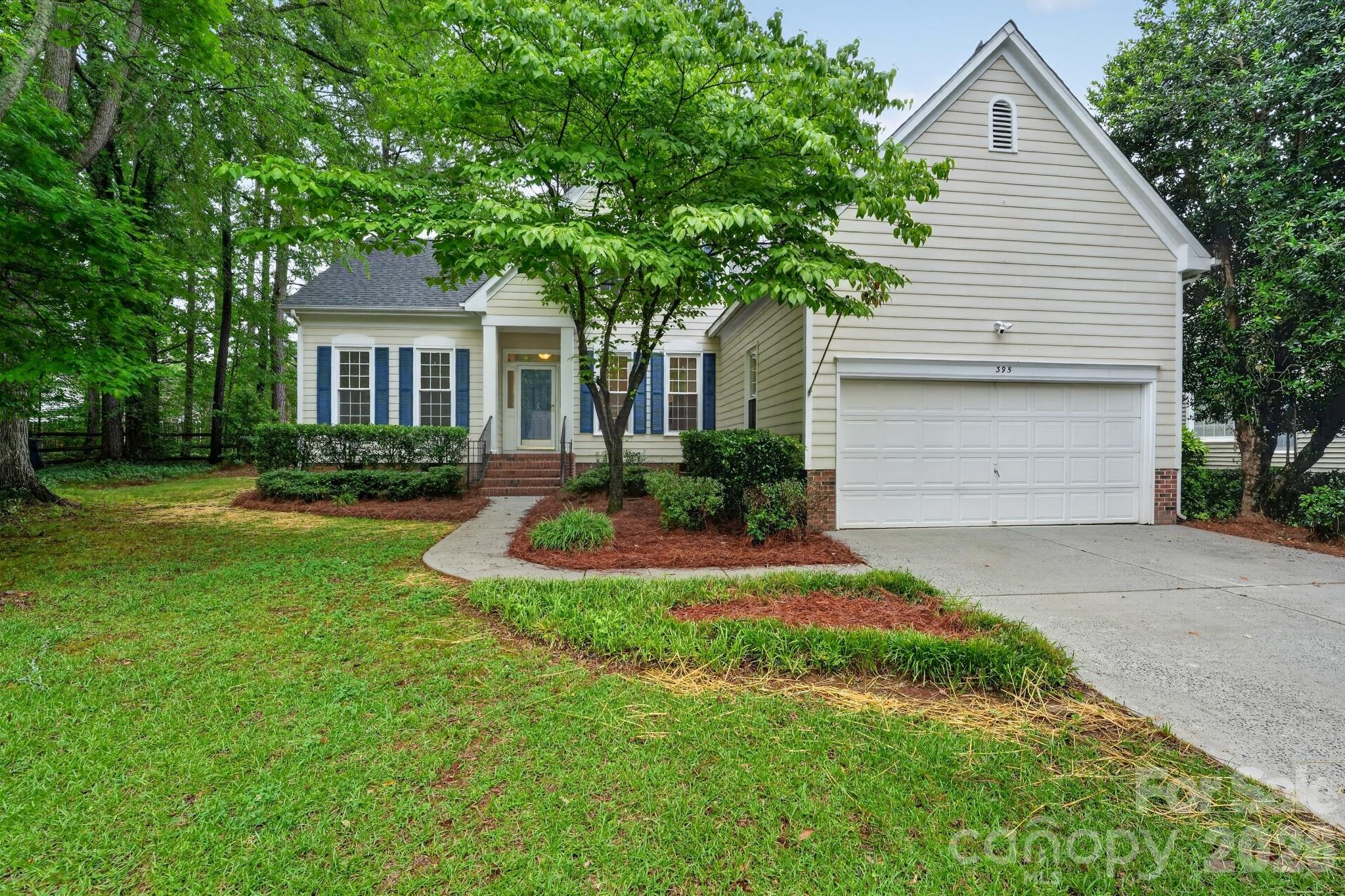 Beautifully maintained and move-in ready, this 4-bedroom, 2.5-bath home offers spacious living areas, abundant natural light, and a functional layout designed for comfortable everyday living. Fresh interior paint and updated light fixtures create a bright, inviting atmosphere throughout, while the open kitchen provides ample cabinet space, generous prep areas, and seamless flow into the dining and living spaces. The living room with fireplace serves as a warm gathering space, and the spacious primary suite offers a relaxing retreat with an en-suite bath and large windows overlooking the backyard. A new water heater adds additional value and peace of mind, while the private backyard with mature trees provides plenty of room to relax, entertain, or enjoy outdoor living.
