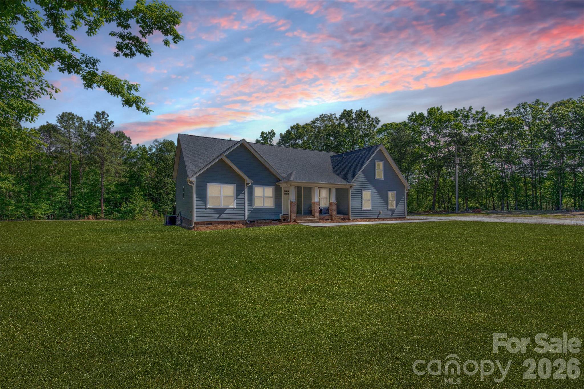 Tucked away on 14.289 acres of peaceful privacy, this home offers the kind of lifestyle buyers dream about but rarely find. Surrounded by room to roam, this property is perfect for those craving country living, outdoor adventure, or simply space away from neighbors. Whether you enjoy hunting, riding ATVs, keeping animals, gardening, or simply enjoying the quiet from your porch, this property delivers the freedom to live life your way.

Built with durable Hardie board siding and thoughtfully designed for both comfort and functionality, this spacious home features 4 bedrooms and 3 full baths on the main level, including TWO primary suites downstairs, making it an incredible setup for multi-generational living, guests, or added flexibility. Upstairs offers a large bonus room with an additional full bath that could easily serve as a media room, home office, guest retreat, or playroom.

Inside, the open-concept layout and split-bedroom floor plan create the perfect balance of togetherness and privacy. The main living areas flow effortlessly, making everyday living and entertaining feel easy and inviting. The windows bring in natural light and showcase the peaceful setting surrounding the home.

Outside is where this property truly shines. The 40x40 shop provides endless possibilities for equipment storage, hobbies, a workshop, recreational vehicles, or outdoor gear. A double garage, covered front porch, and back deck add even more space to enjoy the outdoors and take in the quiet surroundings. With over 14 acres, there is room for hunting, ATV trails, animals, homesteading, gardening, or simply enjoying the privacy that is becoming harder and harder to find.

Located in the highly desirable Buford School District and conveniently positioned near Monroe, Lancaster, Pageland, Waxhaw, and Charlotte, NC, this property offers the perfect blend of country living and accessibility.

If you've been searching for a private acreage home, home with land, newer construction (this home was built in 2021), multi-generational floor plan, property with a shop, hunting property, or mini farm potential in the Buford area, this one brings the whole country-living starter pack.