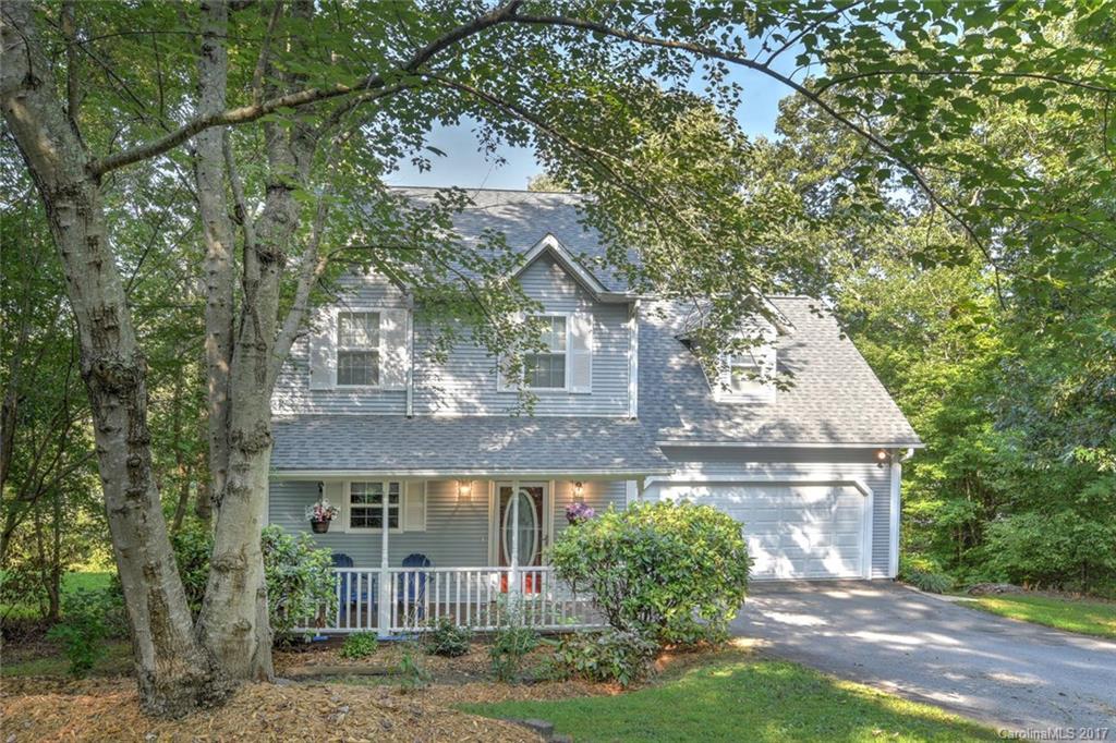 Beautiful Home In A Cozy Neighborhood Tucked Away At The End Of The Street Near The Cul-De-Sac. Featuring A Brand New Roof, Covered Front Porch, Spacious Living Room w/A Fabulous Gas Fireplace, Lovely Kitchen w/Pass through Window to the Dining Area, 3 Bedrooms & 2.5 Baths, Wonderful Screened In Back Porch That Overlooks The Woods, Great Family Room In the Basement That Opens To Fenced Backyard & Large 2 Car Garage. Convinent To Schools, Shopping & Vibrant Downtown Asheville. This Is A Must See!