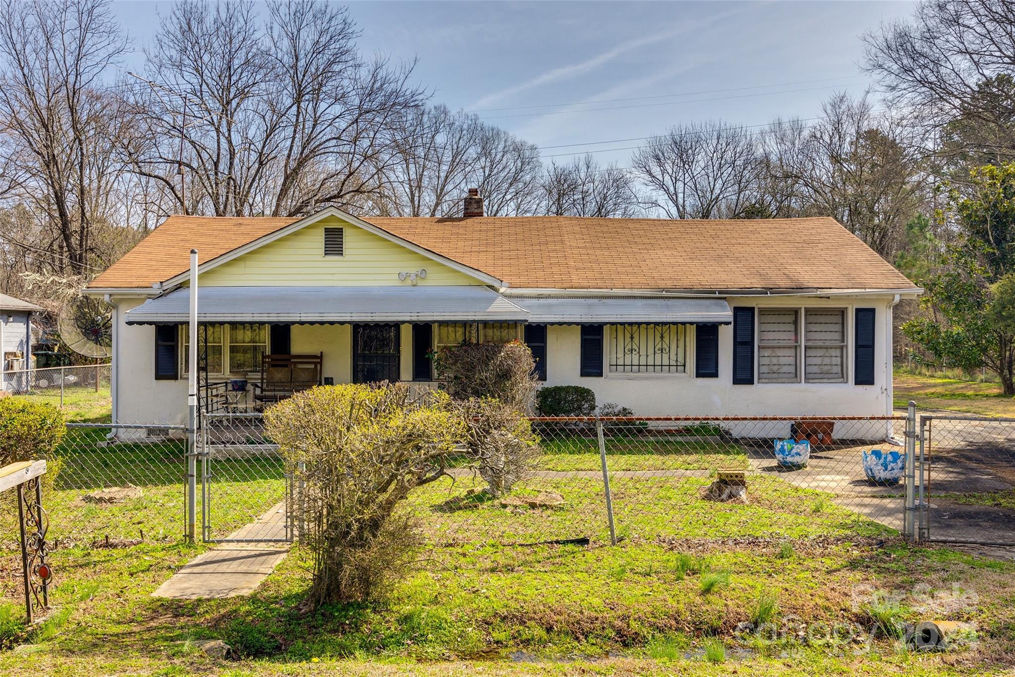 This fixer-upper could make a lucrative investment for the savvy investor. With potential space to create a third bedroom, and a second bathroom, the home awaits a creative touch. The double lot opens the door for upgrading the appeal of the home with fresh landscaping and potential for outdoor living space. Centrally located just a few minutes from downtown Rock Hill, this private street offers the convenience and charm of the city, without the noise. Don't miss your chance to make a wise investment, schedule a showing today.