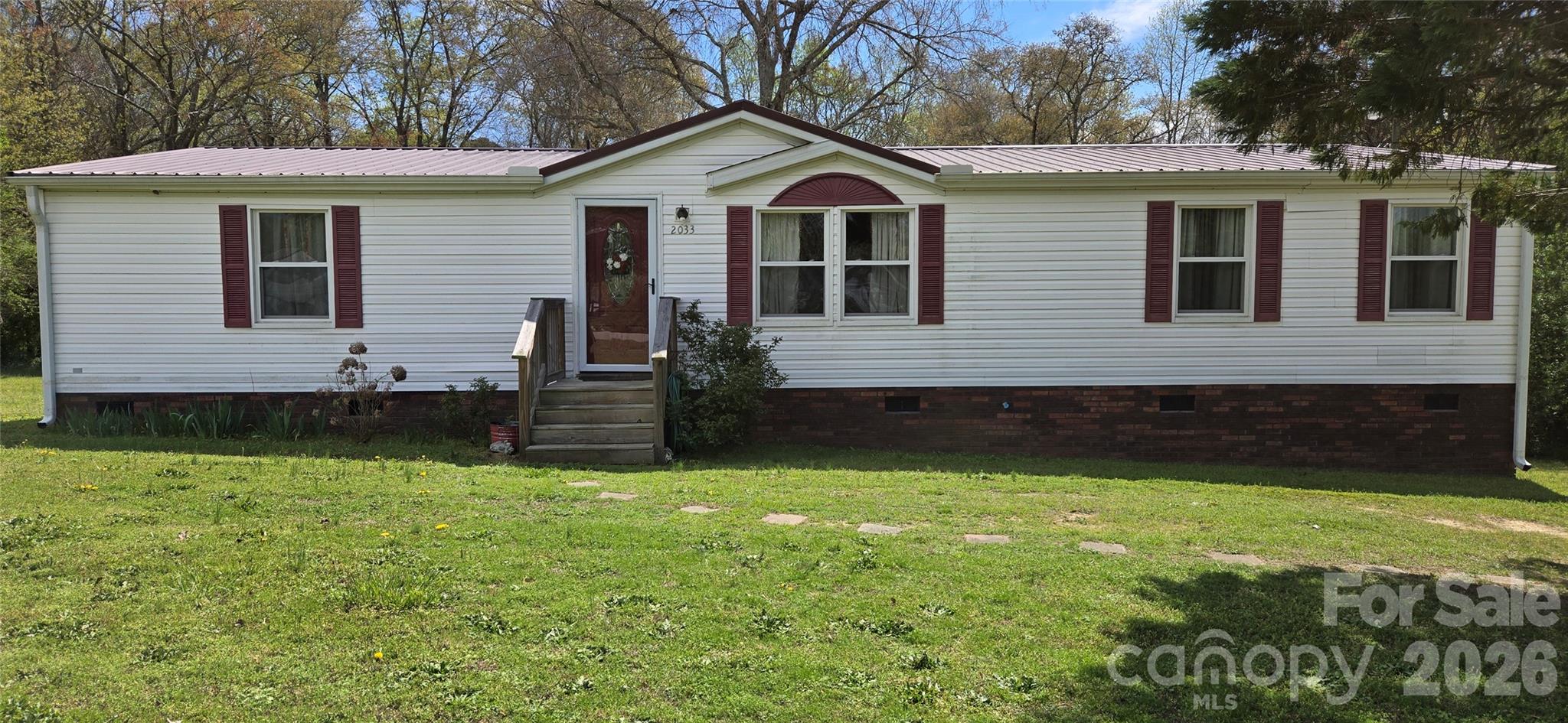 Welcome to this affordable and inviting 3 BR, 2 BA home set on a generous 1.13 Acre lot, offering the perfect blend of comfort, space, and a peaceful country feel, without sacrificing convenience. Inside, you’ll find a thoughtfully designed split-bedroom floor plan that provides privacy for the spacious primary suite, complete with its own en-suite bath. The additional bedrooms are well-sized and ideal for family, guests, or flexible use. A dedicated office space makes working from home both easy and comfortable. The heart of the home features a functional kitchen with a center island, perfect for meal prep, casual dining, or gathering with friends and family. Step outside to enjoy the back deck—an ideal spot for relaxing or entertaining while overlooking the expansive, fully fenced backyard (approximately 70' x 90', 5 feet high), offering plenty of room for pets, play, or gardening. Additional highlights include a storage building for extra space, this second roof is a durable metal roof with major updates completed in 2016, including HVAC, roof, and windows approximately 2019, New door locks, New Back Door, fresh paint in BR & New kit sink faucet to be installed. With no HOA dues, you’ll enjoy both freedom and affordability, tucked away enough to enjoy a quiet, country-like setting, this property truly offers the best of both worlds. Don’t miss your opportunity to make this charming home your own! MOTIVATED SELLER. In USDA District with NO Money Down if qualified.