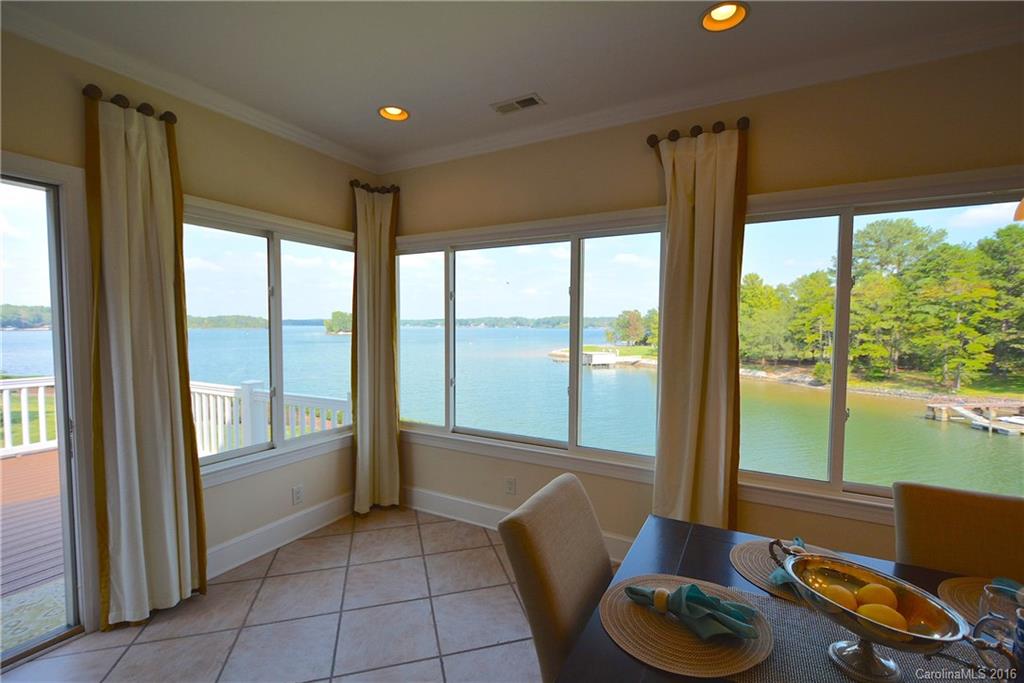 P A N O R A M I C   V I E W S of W A T E R from this Spectacular Home situated perfectly on LAKE WYLIE in exclusive Lake Club community. Breathtaking WATER VIEWS IN NEARLY EVERY ROOM! Enjoy the resort lifestyle w/ your DEEDED BOAT SLIP! Enter private courtyard to a full brick home adorned w/ exquisite detail from hardwoods open floor plan endless custom built-ins surround sound upgraded gourmet kitchen rod iron banister staircase elevator movie theater 5th bedrm potential in-law suite or office.