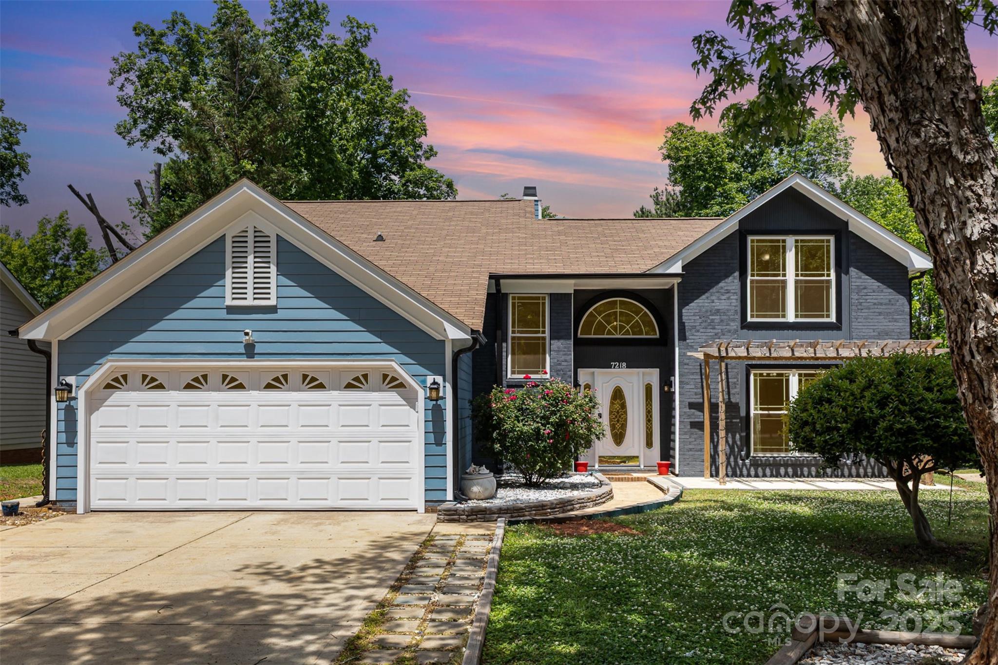 Welcome to this bright, inviting home in a prime South Charlotte location with NO HOA! This thoughtfully updated property features a spacious main-level primary suite with a large walk-in closet and a beautifully renovated bathroom with dual vessel sinks and tiled walk-in shower The airy, open layout includes bamboo floors and a two-story living room filled with natural light and anchored by a cozy gas fireplace. The kitchen offers timeless white cabinetry, granite countertops, and updated appliances — all leading to an incredible 300+ square-foot sunroom that overlooks the private backyard. Upstairs you’ll find a flexible loft space (can easily be enclosed for additional bedroom), two additional bedrooms, and a full bath. Recent improvements include brand-new windows in the main house, a freshly painted exterior, updated primary bath and a new parking pad. With great curb appeal and a convenient location near shopping, CLT airport and dining this home is ready for its next chapter.