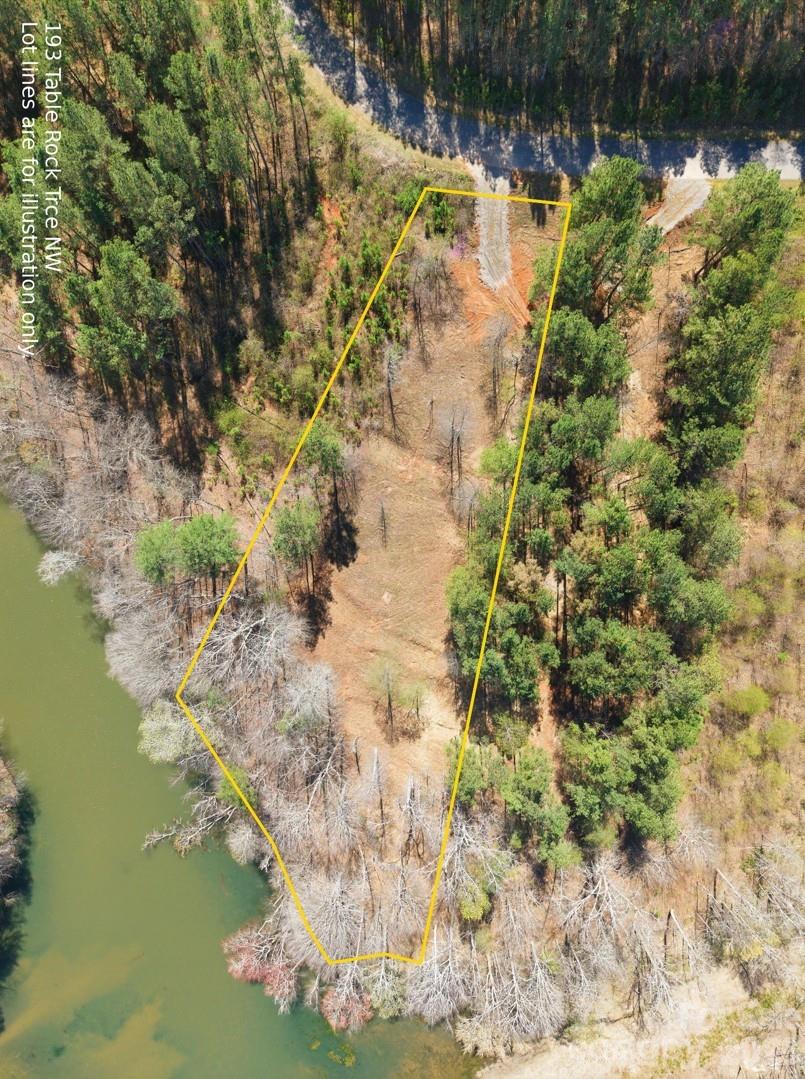 Reduced $35,000 from original price!! A truly rare find! With approximately 212 feet of Lake frontage, this Lake front property has been cleared and is listed for under $100,000! When bought with the neighboring lot, you can enjoy over 365 feet of water views and access to call your very own! (Lots 129 & 130)

City water and sewer, community overlook pavilion with gorgeous views, tables, chairs, grill and bathroom perfect for entertaining. There is also a Community garden and gazebo and a community boat and paddleboard launch. 

There are multiple current builds happening in this beautiful community. Come be a part of the growth! Build your own dream home and wake up to breathtaking views of the water and mountains.

This premium lot has been cleared, giving you a rare advantage—buyers can now truly visualize both the homesite and the stunning lake backdrop. This property offers the perfect canvas with a head start.

Conveniently located while still offering privacy and natural surroundings. Bring your builder and start planning your dream home on Lake Rhodhiss.

Buyers/Buyers Agent to verify docking process with Duke Energy. Lot was deemed dockable by Duke Energy many years ago but that has expired and will need a new application. Seller fought tax hikes making the tax value look low, but value can be seen on the neighboring lots and the buyer can enjoy less taxes.