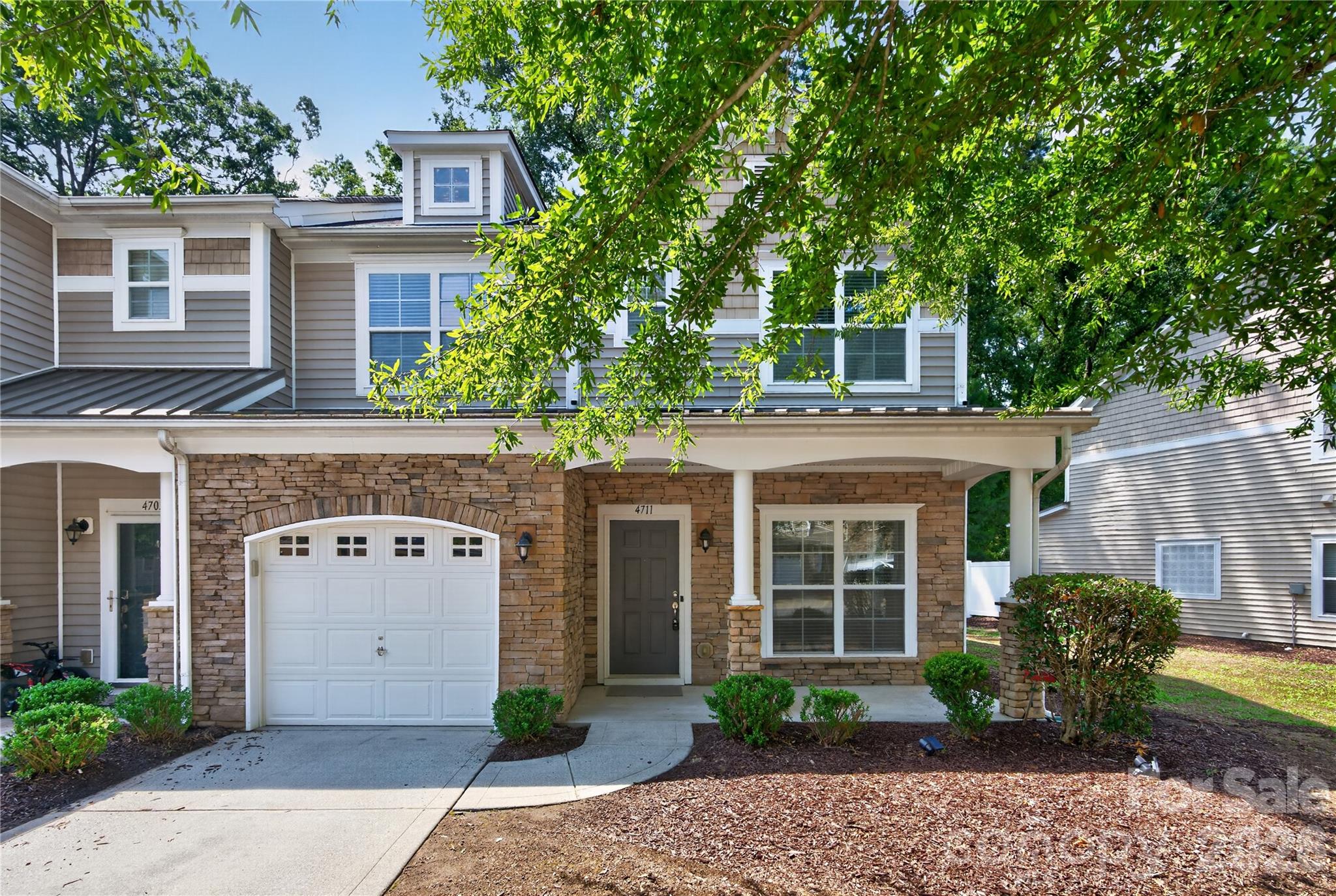 Beautifully maintained end-unit townhome in the highly desirable Berewick community — freshly updated and move-in ready!

This bright and inviting home features an open floor plan with fresh paint throughout, new granite countertops in the kitchen, and updated flooring throughout the entire home completed last year. The spacious kitchen offers beautiful 42-inch cabinets, ample counter space, and overlooks the impressive two-story great room, creating the perfect layout for everyday living and entertaining. A formal dining room provides additional space for family gatherings and special occasions.

The main-level primary suite offers comfort and convenience with a large walk-in closet and an en-suite bathroom featuring dual vanities, a garden tub, and a separate shower. The main level also includes a laundry room, pantry, powder room, attached one-car garage, and a covered rear patio—perfect for relaxing outdoors.

Upstairs, a spacious loft provides flexible living space ideal for a home office, media room, fitness area, or playroom, along with two generously sized bedrooms and a full bathroom.

Community amenities including a pool, playground, walking trails. Conveniently located near Berewick Town Center, shopping, dining, I-485, and Charlotte Douglas International Airport.

Located in the sought-after Berewick community, with easy access to shopping, dining, entertainment, major highways, and Charlotte Douglas International Airport. Enjoy modern updates, low-maintenance living, and a prime location in one of Charlotte’s most convenient neighborhoods!