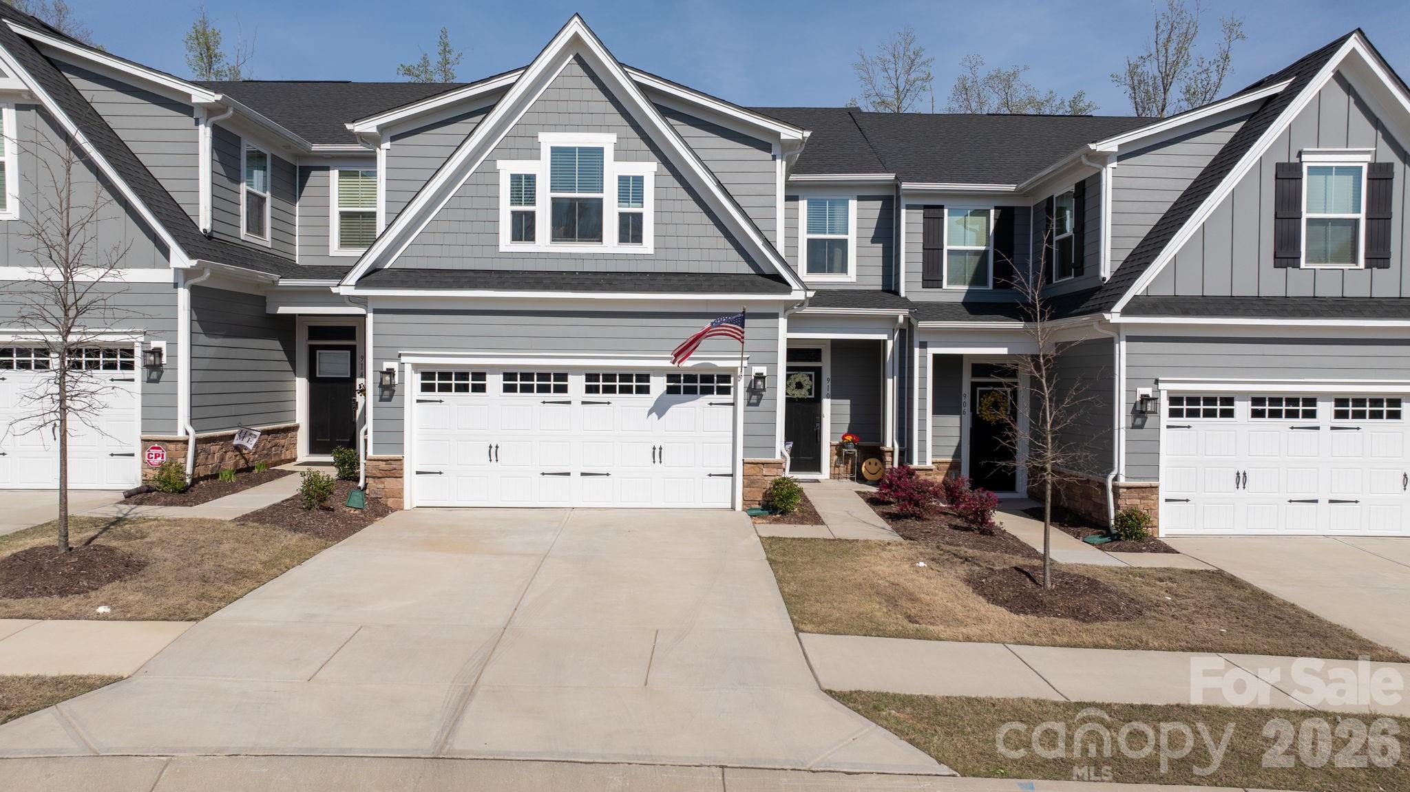 Primary suite on main level – one of the more desirable layouts in Rivercross. Home shows well and has been well maintained. Features include quartz countertops, gas stove, LED lighting per owner, and upgraded finishes. Fenced backyard with covered patio backing to wooded/open space for added privacy. 2-car attached garage. Community offers clubhouse and pool amenities. HOA is $275/month per owner and covers exterior maintenance and common areas (agent to verify).