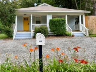 Completely reimagined from the studs out, this beautifully renovated home offers the perfect blend of modern comfort, thoughtful updates, and an exciting location in the heart of Swannanoa. Originally configured as a duplex, the home was transformed during a comprehensive 2022 renovation into a spacious 3-bedroom, 2-bath single-family residence featuring 1,334 square feet of open-concept living.

Virtually every major component has been updated, including new plumbing, electrical, HVAC, spray foam insulation, crawl space insulation with vapor barrier, drywall, interior and exterior paint, fixtures, appliances, window blinds, and select replacement windows. The original hardwood floors have been beautifully refinished, while luxury vinyl plank flooring was installed in the kitchen, laundry room, and bathrooms, with new carpet in the primary bedroom and newly created walk-in closet.

The stylish kitchen features new cabinetry, stone countertops, and stainless appliances, while both bathrooms have been completely refreshed with new vanities, toilets, tile backsplashes, and tub/shower surrounds.

Outside, you'll appreciate the updated front porch with new deck boards, new front and rear doors, off-street parking for 2-3 vehicles, and a private backyard complete with an 8-foot privacy fence, newly planted Green Giant privacy trees, and a Honeycrisp apple tree that's expected to begin producing fruit soon with help from a nearby crabapple pollinator.

For added peace of mind, the home sustained no flooding or structural damage during Hurricane Helene, with only minor fence damage from a fallen tree in the rear corner of the property.

Location is another standout feature. Just minutes from the exciting new Beacon Park and Beacon Bike Park development, scheduled to open in Fall 2026, you'll enjoy access to future community green spaces, a walking track, playground, pavilions, a world-class bike park, bouldering walls, and an event lawn. The neighborhood is already experiencing exciting growth, with coffee shops, a hardware store, grocery store, and new restaurants all just minutes away. Conveniently located only 15 minutes to downtown Asheville and 7 minutes to Black Mountain, this move-in-ready home offers the perfect combination of quality, convenience, and long-term value.