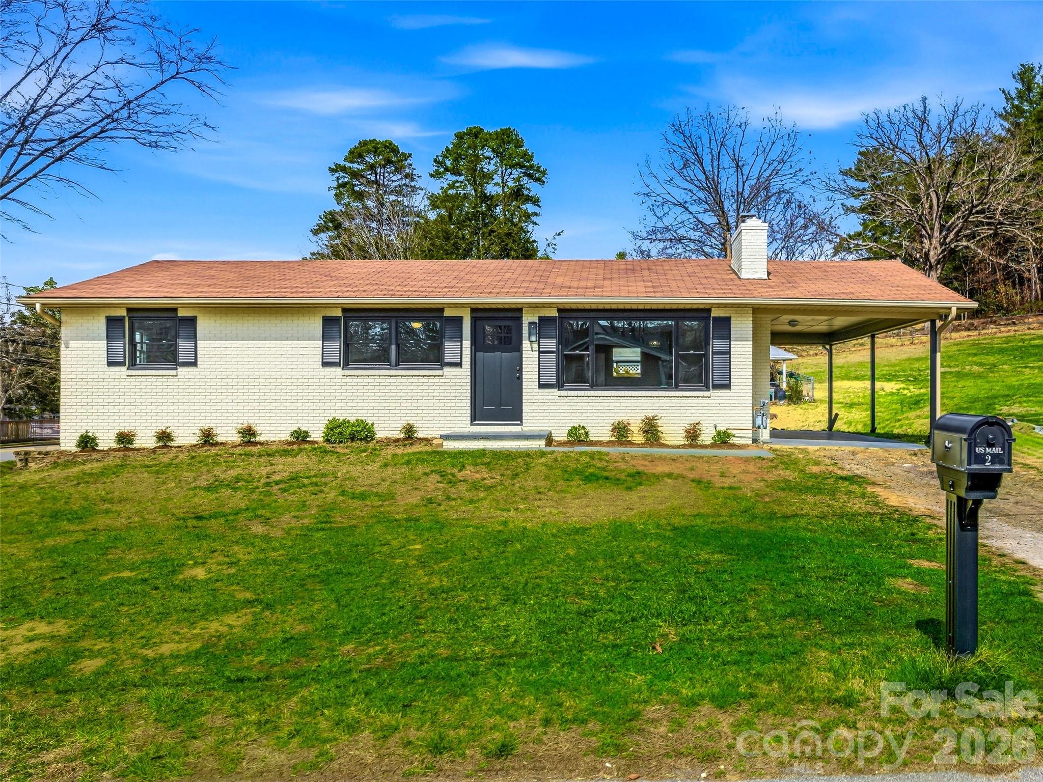 Beautifully renovated brick ranch home on a corner lot on Main Street Weaverville. Easily walk to all that the town of Weaverville has to offer - Great restaurants, breweries, artisan shops, the park, Well Bred Cafe, the Library and lots more! The kitchen is brand new with a kitchen island that will seat 4, drawer microwave, quartz countertops, range hood, Diamond cabinets. The bathrooms are new from the studs out. The basement is freshly painted with a new picture window, exterior door and high ceilings waiting for you to create whatever space your heart desires. Come see this gem for yourself!