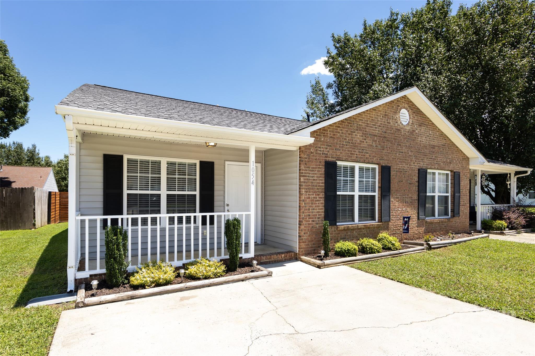 Perfect two bedroom/ two bath completely updated one story townhouse in the heart of Rock Hill! Bright kitchen features beautiful white cabinetry, granite countertops and stainless appliances. Both bathrooms have been remodeled.  Luxury vinyl plank flooring throughout most of the home with plush carpeting in the bedrooms. Fenced in yard area. Shows like a new house!! Refrigerator and Washer/Dryer convey! Minutes to Winthrop University!
HVAC replaced in 2021. Roof replaced in 2021. NO HOA!