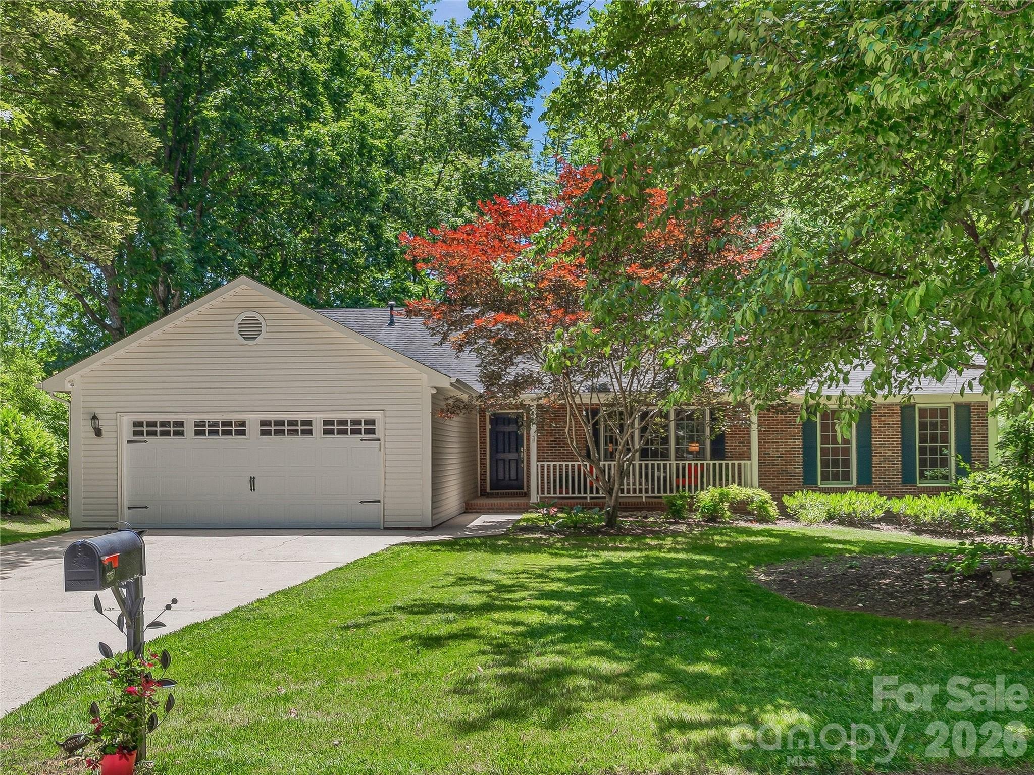 Come home to one level, one speed, and zero compromise. This brick ranch on a quiet cul-de-sac in Fletcher is the kind of place where Saturday mornings start slow on the covered front porch and Sunday afternoons end at the grill on the back deck — your fully fenced yard keeping the world at exactly the right distance.

Inside, the split-bedroom floor plan gives everyone their own space. The expansive great room — hardwood floors, gas fireplace — is where the day winds down. The kitchen is built for real cooking: granite countertops, gas cooktop, stainless appliances, and enough room at the table to linger over coffee. The primary suite is a true retreat with a walk-in closet and a beautifully remodeled bathroom (2023).

Out back, the fenced yard is yours to fill — garden beds, a firepit, room to throw a ball, or simply nothing at all. The attached 2-car garage with built-in workbench gives you space for projects, storage, or the mountain bikes.

Fletcher puts you minutes from Hendersonville, a short drive to Asheville, and close to the Blue Ridge Parkway — with all the convenience and none of the traffic. Schedule your private showing today.