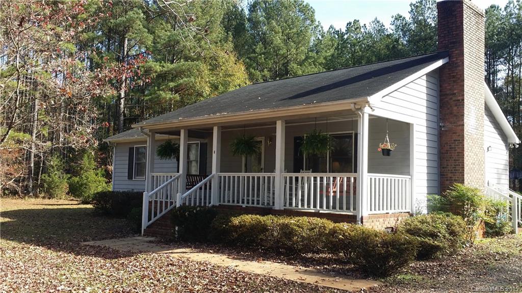 Look NO further! This one has it all! Country area with a sweet private country feel, tree lined level yard, 1.72 acres and the sweetest gathering front porch with two swings for crisp mornings with a tall cuppa Joe or sunny afternoons where friends and neighbors gather for a visit! Three bedrooms, two full baths a large eat in kitchen with tons of cabinets! Room for tons of parking! A wood burning fireplace for chilly winter evenings, a deck out back and a separate detached WORKSHOP/garage.
