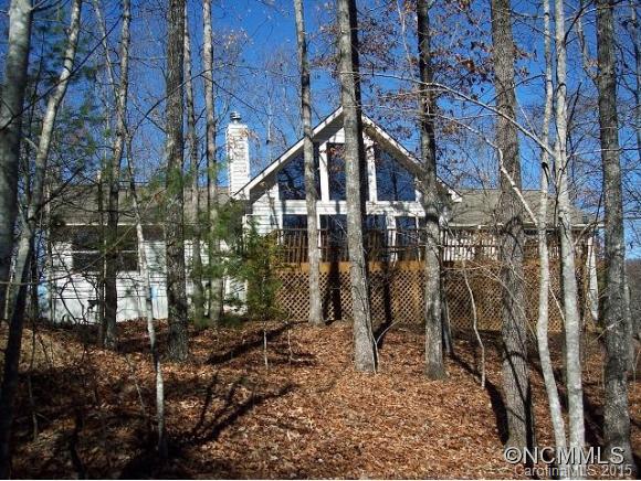 Open floor plan great for entertaining,eat in kitchen,DR,lg.pantry,big laundry room,soaring ceilings in LR with tongue/groove wood.Rock F/P.Wood cathedral ceiling in master suite,oversized windows mostly facing south.Built at back of lot for privacy,gentle topography with areas for gardening.Large "Potting Utility"bldg.Winter views.Workshop/storage.Firepit.New mulch,decks cleaned/repainted,new interior paint.Great house for family or vacations.