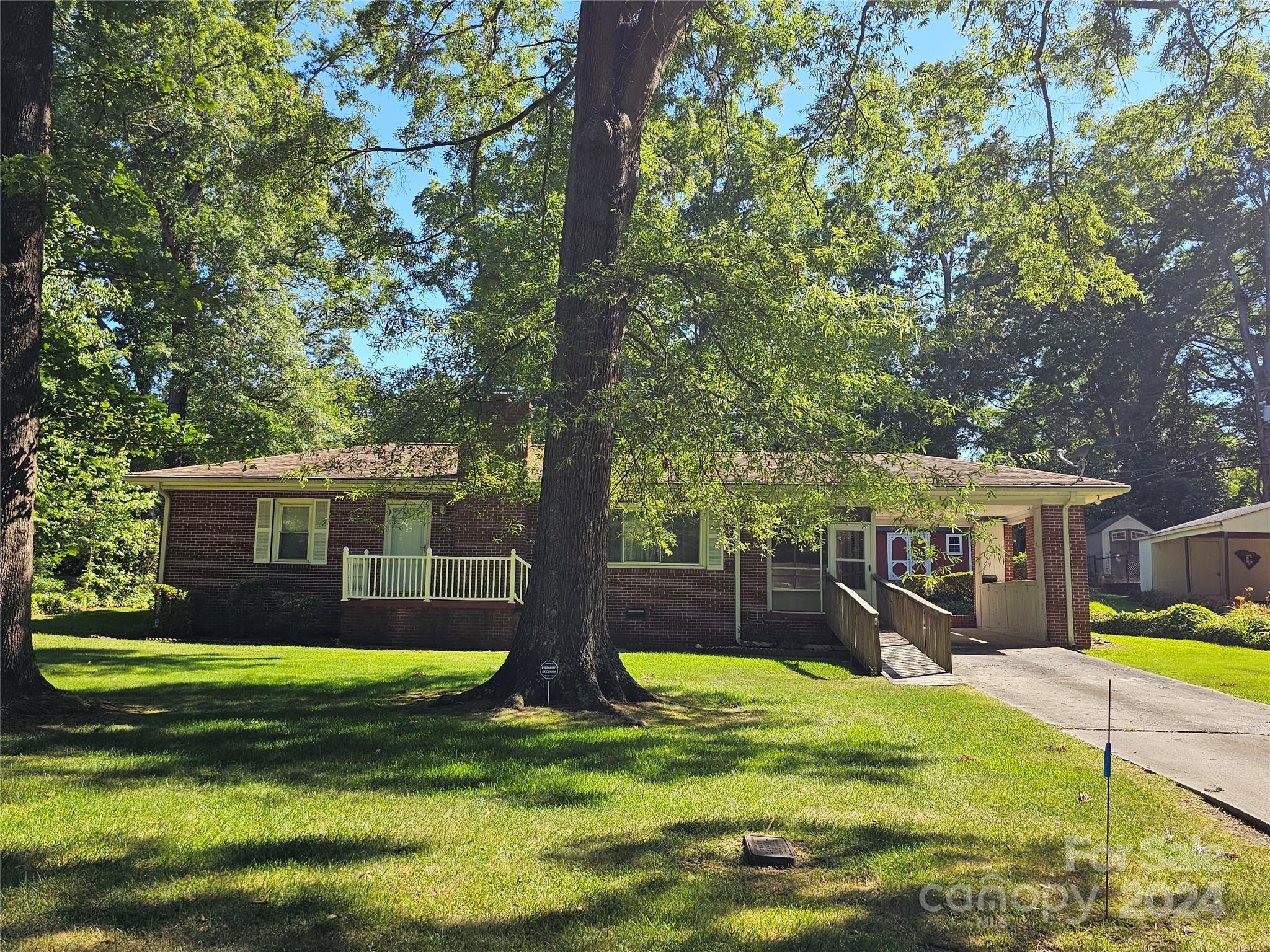 Come and see this lovely older home. Great yard with mature trees, has an outside storage building, single carport, screen side porch. Formal living/ dining room. Den with knotty pine paneling could possibly be a 3rd bedroom by adding a closet.
