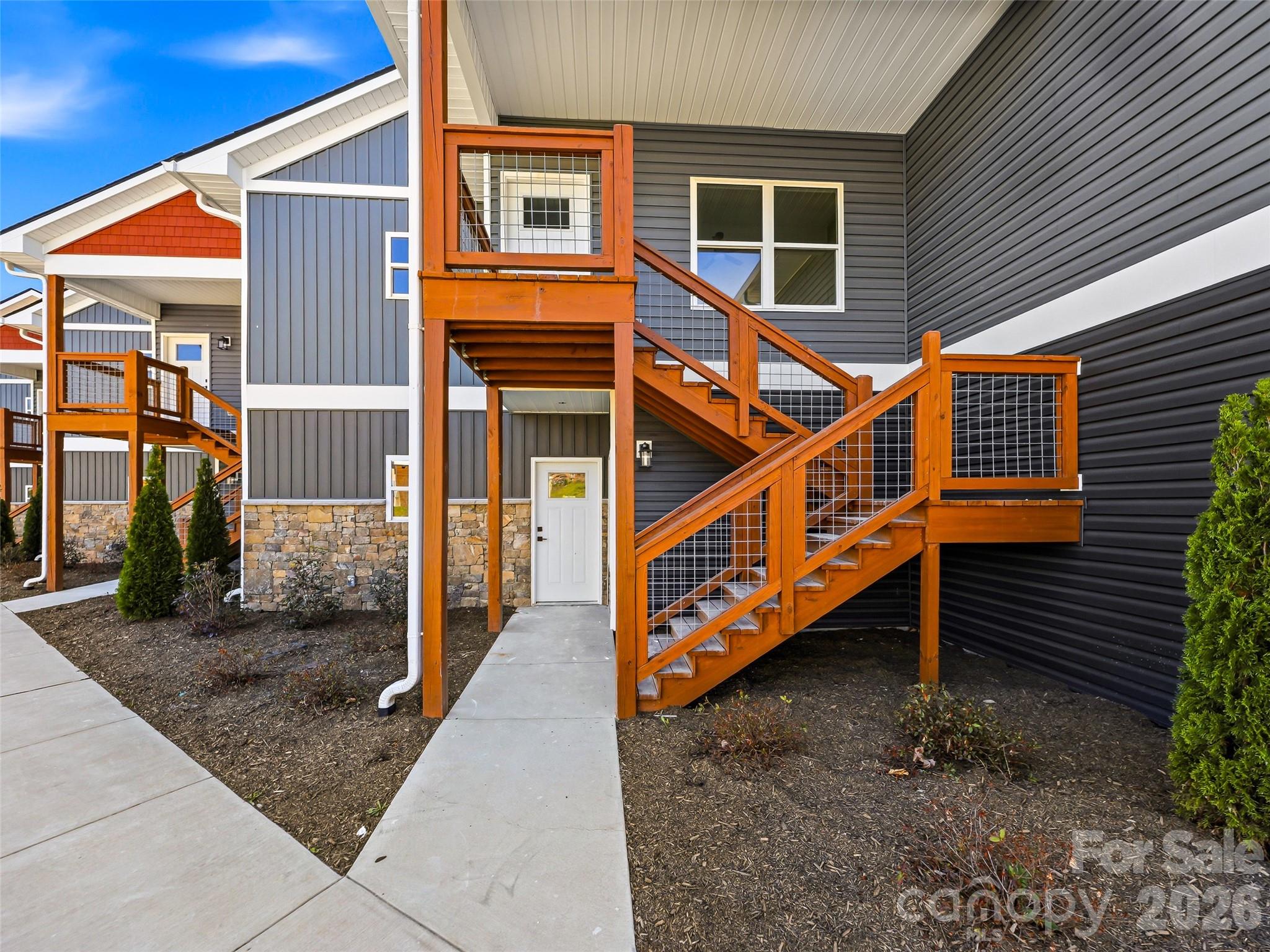 Main-Level Living and New Construction. Welcome to Unit #7 at 143 Carver Street—where accessibility meets an unbeatable location. This thoughtfully designed main-level unit eliminates the hassle of stairs, providing a seamless living experience from the moment you arrive.  Air B and B permitted. 

Nestled in a quiet yet central pocket of Brevard, you are minutes from world-class hiking in Pisgah National Forest and a short stroll to the eclectic shops and music venues of Main Street. The interior boasts a wonderful kitchen and an open floor plan with a layout that maximizes every square foot. The two bedrooms are more than adequate with with walk in closets and full baths.  Enjoy your morning coffee on the private balcony.  

Perfect for those seeking a simplified lifestyle in one of Western North Carolina’s most sought-after towns. Schedule your showing today and see why Carver Street is Brevard’s best-kept secret.  The finished unit shown is an example  the benefit you have on this offering is you can meet with the developer and pick many of your finishes.  Cabinets are in place already. We do have other units if your looking for an upper unit.