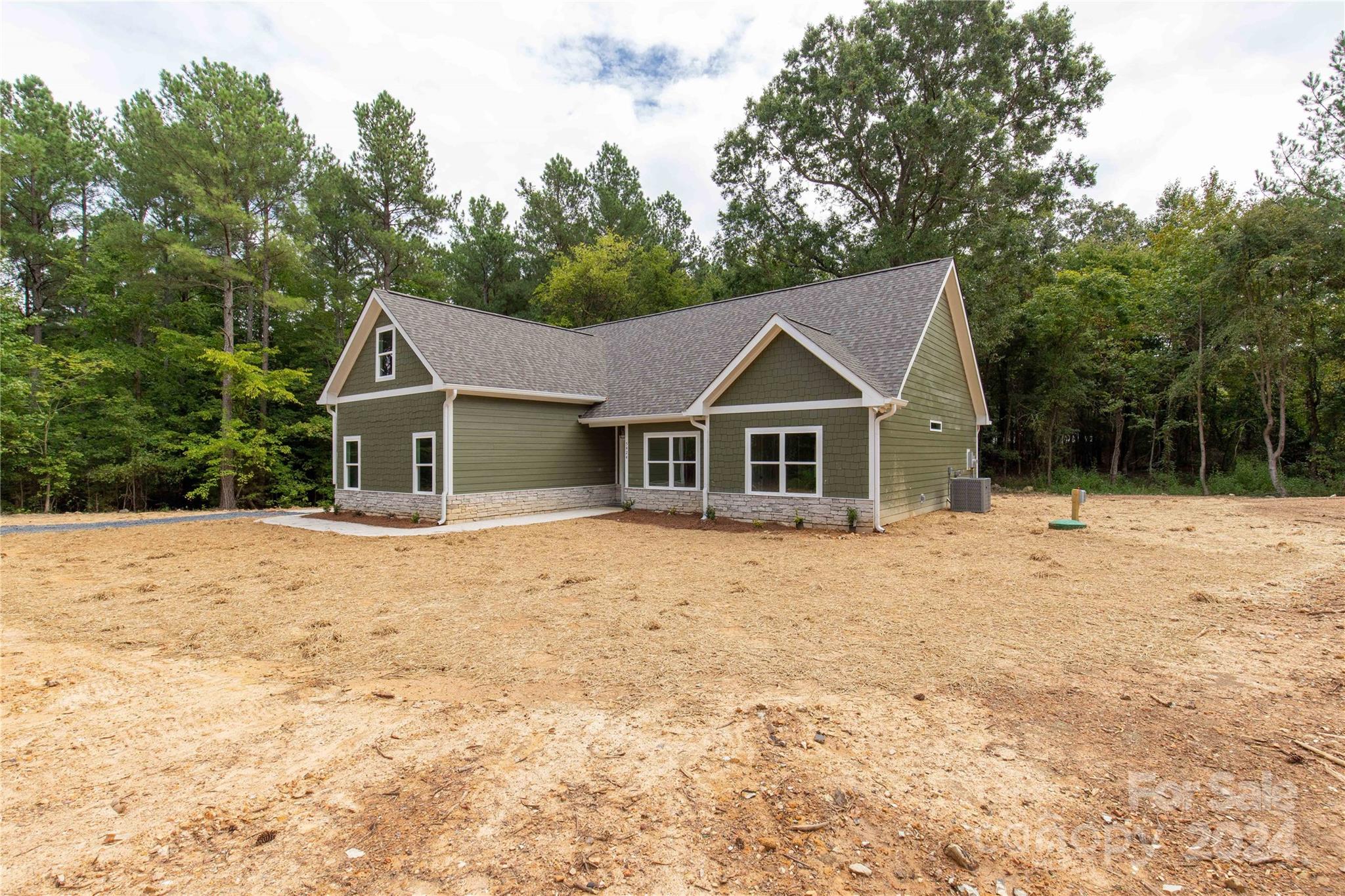 Beautiful new construction home in Marshville on a gorgeous 1 acre lot! You'll love the elegance and design of this home featuring crown molding in the main living areas and primary bedroom suite. Fall in love the moment you walk into this bright and open home! The cook of the home will enjoy the spacious kitchen with a large island perfect for prep work. Tons of windows on the back of the home overlooking the private and spacious yard. The primary bedroom suite is on the main floor at the back of the home and has both a spacious walk-in closet and spa-like bathroom. Enjoy two additional bedrooms located on the main floor. There's an additional full bathroom, bonus room, and another room with a closet upstairs for guests, hobbies or an additional relaxing/recreational area. Enjoy your morning coffee on the back patio or relax at the end of a long day. Closing cost assistance available when using builder's preferred lender. Come out to see this beauty now!