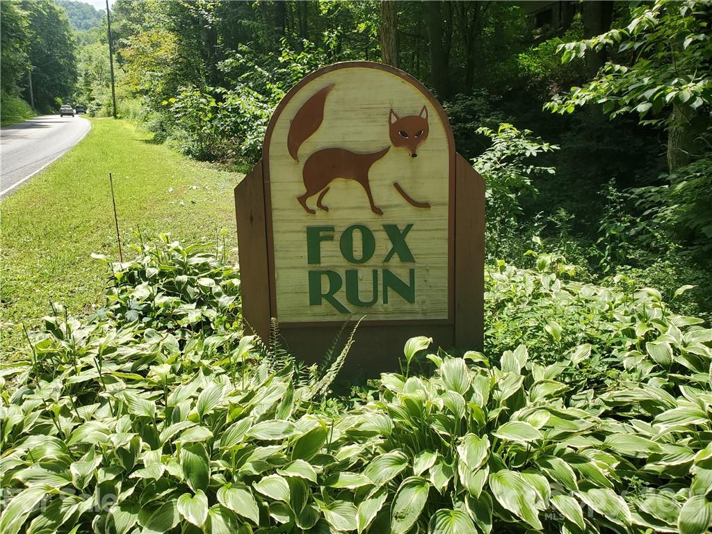 $5000 price reduction!! Awesome gently sloping semi private lot. Ready for your dream home. Views possible with some tree trimming. Priced to sell!  Centrally located in the beautiful Jonathan Creek area in the Fox Run neighborhood. Minutes to downtown Waynesville and Maggie Valley! Just a short distance to Great Smoky Mountain National Park and a short drive to Asheville!. Very light restrictions. Take a look today! PERFECT!