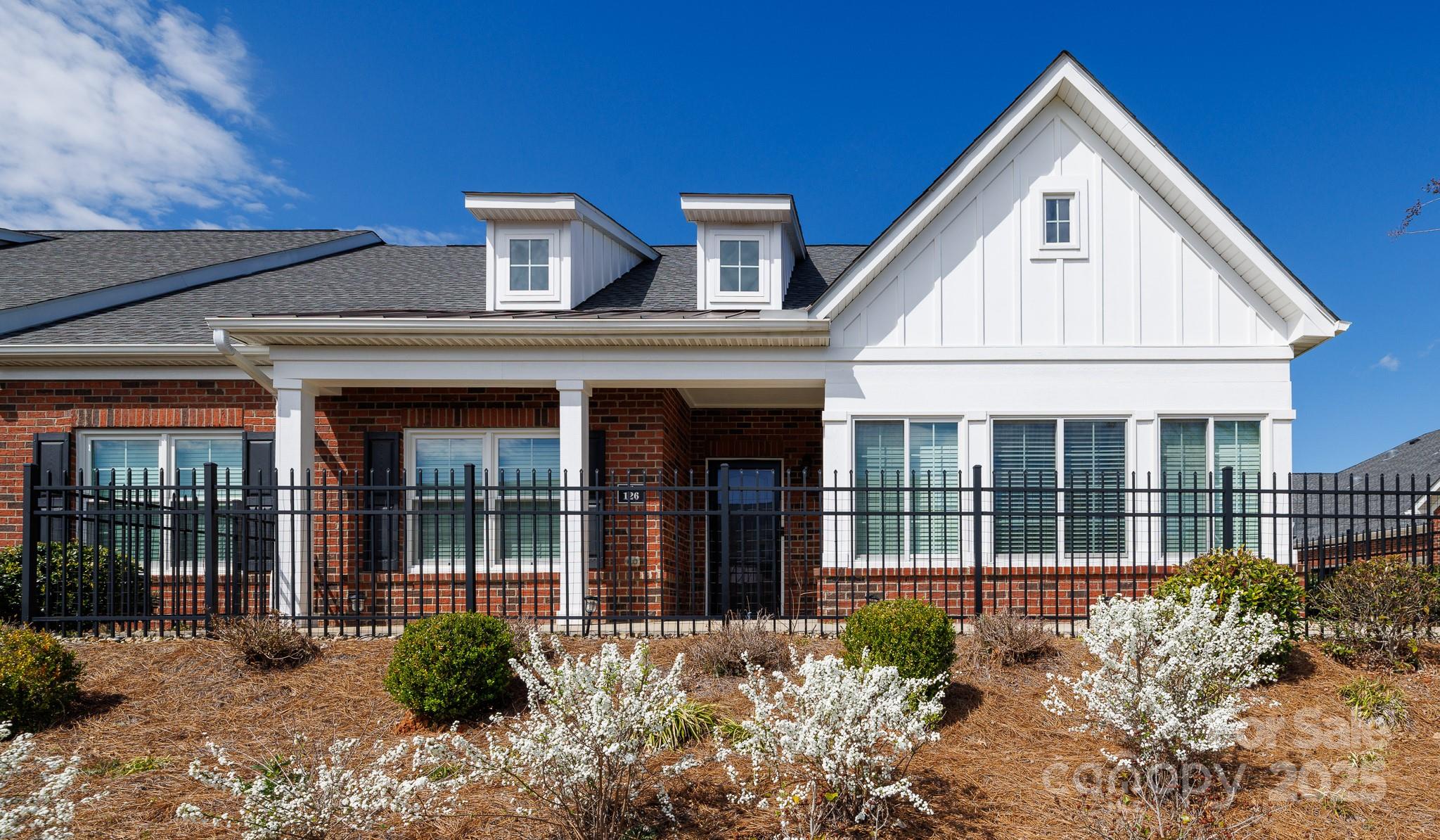 Welcome home to this rare find in Augusta Place!  Comforts of this well maintained home features two bedrooms, two full baths and a four season room.  The kitchen has ample cabinets with solid surface countertops and a breakfast bar overlooking into the family room with a gas fireplace.  Hardwood floors throughout living area, kitchen and sunroom.  Ceramic tile flooring in the bathrooms and laundry room.  Laundry room has a mud sink.  Primary suite includes a private bath with double vanity.  Patio on the front and maintenance free lawn.  Community   amenities include Clubhouse, Fitness Center, Outdoor Pool, Playground, Tennis Courts, sidewalks and trails.  Close proximity to I-77 and Shopping.
