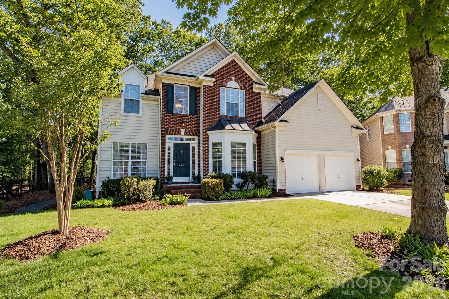 Location, Location, Location! This beautiful home, nestled on a flat wooded cul-de-sac lot, is a must-see in the highly desirable Somerset neighborhood featuring outstanding amenities and award-winning Marvin schools. The main level offers a flexible guest bedroom or home office, full bath, formal dining room, living room, and an impressive two-story great room with a gas fireplace. The gourmet kitchen features white cabinetry, stainless steel appliances, granite countertops, a large island, and two pantry closets. Hardwood floors flow throughout the first floor, while oversized windows fill the home with natural light. Upstairs, the spacious primary suite boasts a tray ceiling and is complemented by two secondary bedrooms and a versatile loft space. Relax year-round in the enclosed rear porch overlooking the private wooded backyard—perfect for entertaining or enjoying quiet evenings around the fire pit. Community amenities include a pool, playground, recreation area, and pickleball/tennis courts. Conveniently located near Blakeney, downtown Waxhaw, and south Charlotte, while benefiting from low Union County taxes. * some pictures have been virtually staged