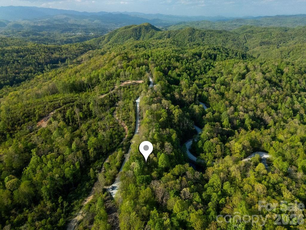 Escape to the mountains with this beautiful, private one-acre homesite in the sought-after Eastatoe Gap Mountain Estates of Transylvania County. Featuring a buildable homesite, potential long-range views, and a peaceful, wooded setting, this property blends natural beauty with practical usability. Dual access from both Nancy Mountain Road and Eastatoe Gap adds convenience and flexibility for your future build. Whether you envision a quiet getaway or a full-time residence, this is where your mountain dream can take shape.