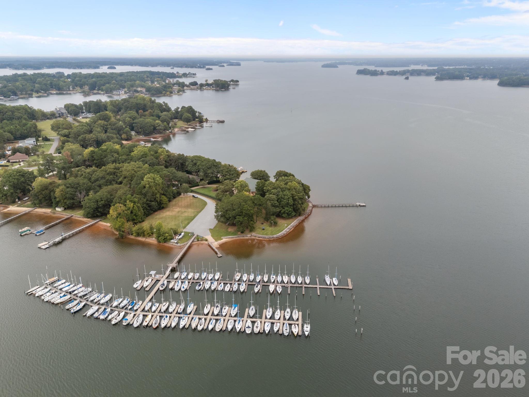 Welcome to 1887 Yacht Club Drive. The Historic Lake Norman Sailing Club occupies this property and is a sailors delight. Enjoy over 1.38 acres of serenity, over 100 slips, more than 450 ft of shoreline, clubhouse with clubroom, sailing masters quarters with 2 bedrooms, kitchen, and living area. Plenty of parking and more spaces available. Majestic oak trees encompass the property. This has been an icon of lake life and sailing life on Lake Norman. The property being sold is subject to leases that are currently in effect for the sailing club and Duke Energy. Seller requires an NDA and POF for any buyers to receive financial information. This property is also adjacent to another 1.48 acres marketed as MLS 4305437 or $7,500,000. An additional 450+feet of shoreline. The properties are listed as residential/commercial. Residential which opens additional opportunities.

The views and serenity of this property are unparalleled on this lake. It is a property worth a serious look
*****No entrance to the sailing club without permission from agents.****