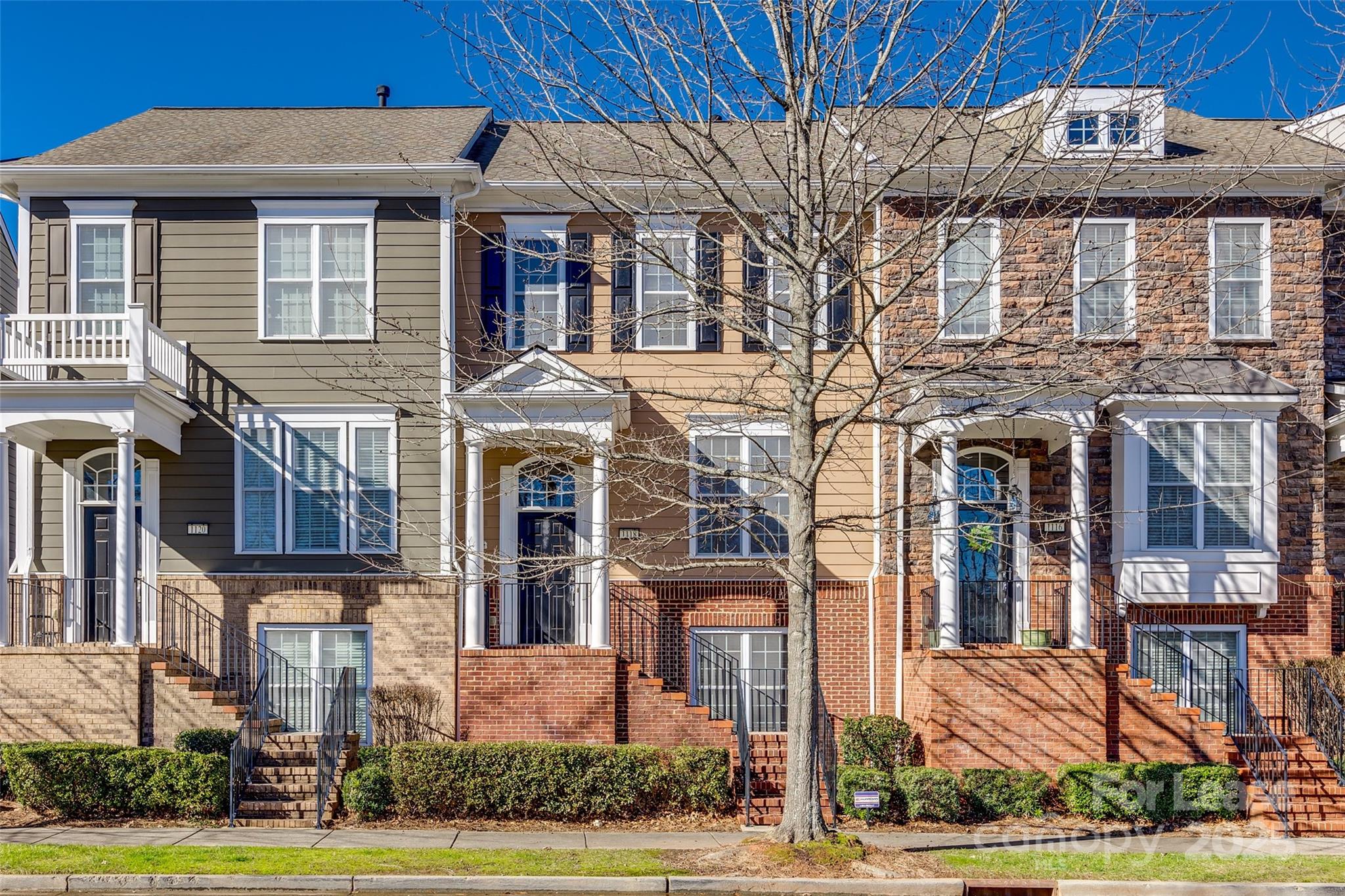 Fabulous Townhome in Baxter features 2 primary suites on the upper level. The kitchen has many perks, custom cabinets, granite countertops, a work island, SS appliances, a gas range, a pantry, and a private deck. A large great room with a gas fireplace and hardwoods on the main. The Primary bedrooms boast tray ceilings, a walk-in closet, and an en-suite bath with solid surface counters. Primary 1 has a double sink vanity and a shower/tub combo. Primary 2 has a single sink vanity and a shower/tub combo. The lower level has a nice-sized bedroom with an en-suite bath, single vanity, and a walk-in shower.  Enjoy the green space in the front and back of this townhome and walking trails! Convenient to interstate, shopping, and dining. Award-winning FORT MILL SCHOOLS! Pets Conditional.  **No Cats**
