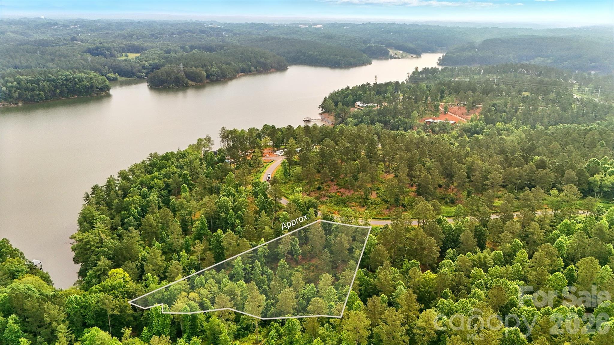 Opportunity to own a lake access lot in the gated community of Lakeside Reserve. Build your lakeside retreat on this parcel with stunning year-round views and direct water access. Wake up to peaceful mornings by the water, enjoy evenings on your future dock, and take in the tranquil beauty that surrounds you. You can fully embrace the lakeside lifestyle—boating, fishing, or simply relaxing at the water’s edge. Lakeside Reserve is rich in amenities designed for both recreation and relaxation. Enjoy a resort-style pool, pickleball courts for active fun, and scenic walking trails that wind through the natural landscape. This gated community blends privacy, beauty, and lifestyle, making these waterfront lots a standout opportunity to enjoy lakeside living at its finest.