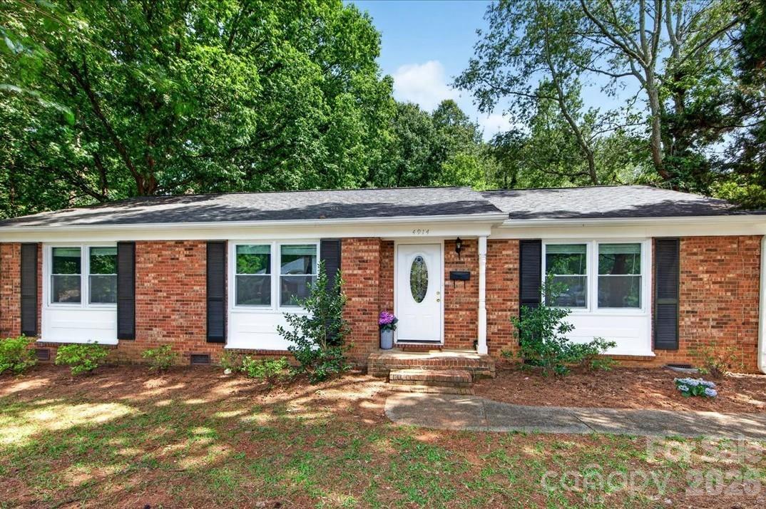 Located in beautiful Coventry Woods, this adorable ranch home balances Charlotte charm with modern updates and valued conveniences. With the open floor plan and updated kitchen, you will feel perfectly at ease entertaining guests, or enjoying daily life with the family. Roof, HVAC, and windows all new in 2021. Home features two nice sized living areas for maximum flexibility plus a dedicated dining area. Modern kitchen with updated cabinetry, granite countertops, stainless appliances and a kitchen island. Spacious den features a wood burning fireplace, laundry closet and French doors leading to the patio. Three bedrooms and two remodeled baths are located on one level making this home accessible to all. Backyard is spacious, flat and fully fenced, with mature trees and storage shed. Located just minutes to uptown, Cotswold, Midwood and Matthews plus great interstate access. You will love everything about 4914 Glenbrier Drive - Welcome Home!!