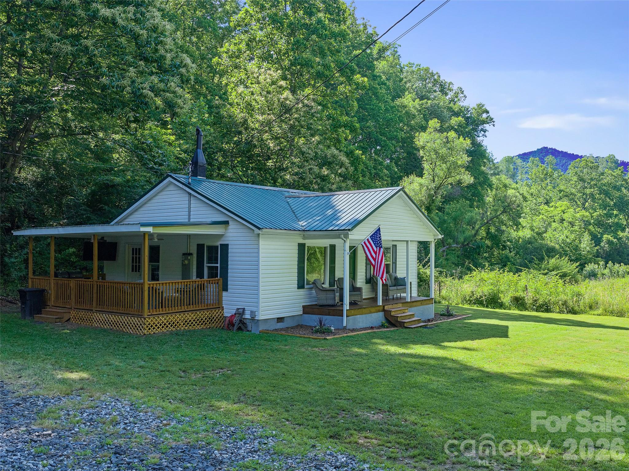 Don't let the age of this house fool you! It has been completely and lovingly renovated from top to bottom, and the result is one sweet home. Sitting on 2.67 beautiful acres with creek frontage right on the property, this cozy charmer checks every box. Inside, everything is new; kitchen, bath, flooring, and updated electric and plumbing. Move-in ready with all the character intact. Top to bottom, the big items are done too; new roof, windows, and doors. Step outside to the brand new covered porch, perfect for entertaining no matter the weather. The acreage offers plenty of room for animals, a garden, and kids to roam freely. And for the fishing enthusiast, the Cane River is just a short walk away. Some furnishings may convey, ask for details. A property this sweet, this complete, and this well-loved doesn't come along often. Come see it for yourself.