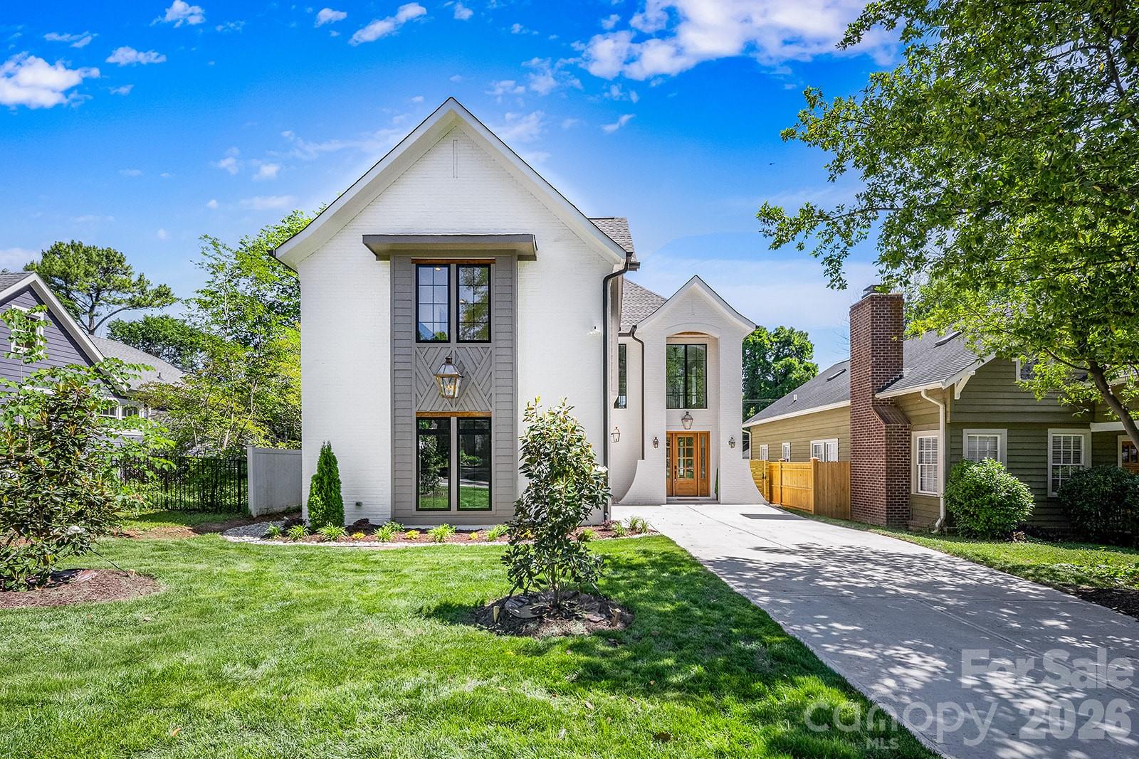 A rare offering in Chantilly, this exceptional new construction combines three highly sought-after features that are seldom found together: a main-level primary suite, a fully equipped scullery kitchen, and a private resort-style backyard with a saltwater pool and spa.

Offering 5 bedrooms, 3.5 baths, and 4,240 square feet of thoughtfully designed living space, this residence showcases soaring ceilings, designer lighting, and white oak flooring throughout. The chef's kitchen serves as the centerpiece of the home, flowing seamlessly into the living and dining areas and complemented by a fully equipped scullery with its own premium appliance package—ideal for entertaining, meal preparation, and everyday functionality.

The main-level owner's retreat provides privacy and convenience, while the upper level offers spacious secondary bedrooms and flexible living spaces designed to accommodate family and guests.

Outdoor living is equally impressive. A saltwater pool and spa anchor the backyard retreat, accompanied by a covered terrace with fireplace and a dramatic sunken fire pit lounge designed for year-round enjoyment.

Ideally located minutes from Plaza Midwood, Elizabeth, and Uptown Charlotte, 2541 Shenandoah Avenue offers a distinctive blend of luxury, functionality, and resort-inspired living in one of Charlotte's most desirable in-town neighborhoods.