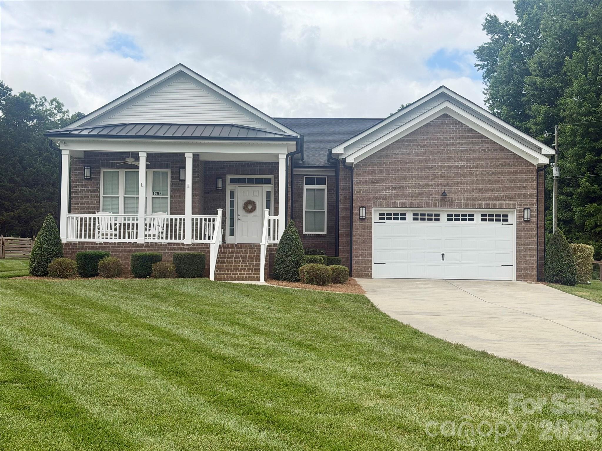 Welcome to peaceful country living on over 4 beautiful acres! This stunning home offers the perfect blend of charm, functionality, and space—inside and out.
Relax on the inviting rocking chair front porch or entertain with ease on the massive covered back patio, complete with ceiling fans and plenty of room for gatherings. The huge fenced backyard provides privacy, and space for your pets to roam, while the charming gazebo and fire pit overlook a stocked pond with fountain, creating your own private retreat.
Inside, you’ll love the open floorplan filled with natural light, real hardwood floors, elegant wainscoting, and tray ceilings that add architectural interest throughout. The spacious dining room features a walkout to the covered patio, making indoor-outdoor living seamless.
The kitchen is a showstopper with a huge island and breakfast bar, gas cooktop, wall oven and microwave, stainless appliances, stainless vent hood, and a dedicated coffee bar—perfect for hosting or everyday living.
The primary suite offers tray ceilings, private access to the covered patio, a tiled walk-in shower with seat, and a large walk-in closet with built-in shelving. Bedroom two includes its own attached bath with walk-in shower, while bedroom three features new LVP flooring.
Additional highlights include a dedicated office/study with pocket doors, a spacious drop zone at the garage entry, and a large laundry room with cabinets and counter space for folding.
If you’re looking for space, privacy, and thoughtful upgrades in a country setting, this one checks all the boxes.