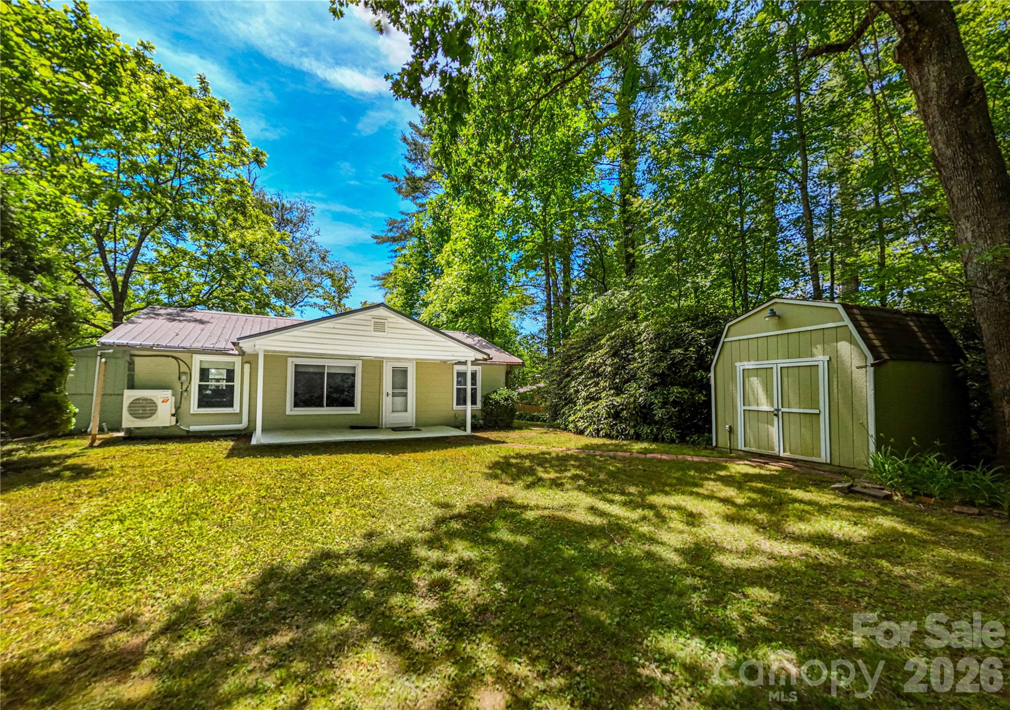 Your ticket to Lake Toxaway living under $300,000! Situated on just over 0.6 acres, this fully furnished 2-bedroom, 1-bath + den concrete block construction home offers a peaceful setting with convenient access directly off a state-maintained road. A canopy of mature trees provides privacy, while the front yard offers a welcoming outdoor space and back yard offers space for an RV. In addition to the two bedrooms the home features a versatile den that can serve as a guest room, home office, hobby space, or additional living area. A separate bank house expands the possibilities even further and would make an ideal art studio, exercise room, workshop, home office, or creative retreat. Conveniently located near the renowned Greystone Inn, Gorges State Park, and positioned between Brevard and Cashiers, you'll enjoy easy access to dining, outdoor recreation, shopping, and all that Western North Carolina has to offer. Whether you're seeking a full-time residence, mountain getaway, or investment property, the home offers excellent potential for both short-term and long-term rental opportunities. Cash purchase only.
