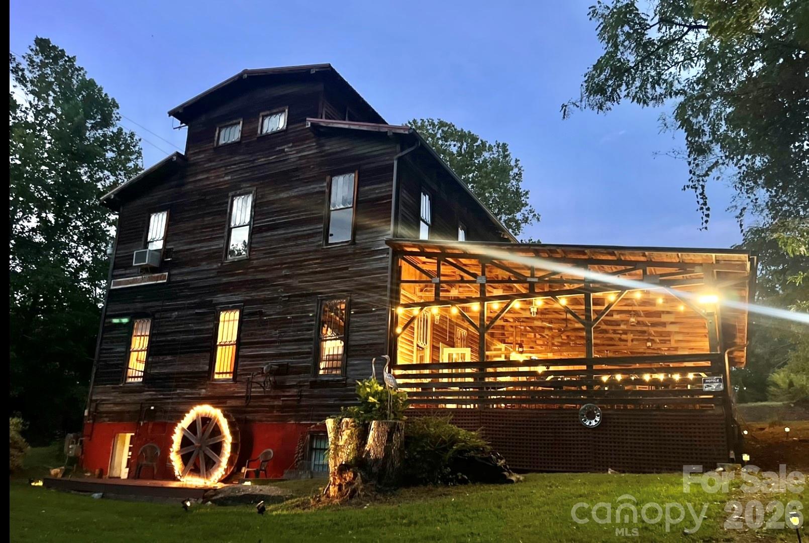 Possible Seller Financing . Historic Weaverville Milling Company.  Circa 1914 ...  Rare Opportunity.....150+ year old Grist Mill / former 150 seat Restaurant includes house and cottage, on 5.25 acres, with a private oasis along 1,000 ft. of bold Reems  Creek waterway. Property is ocated in the County for lower taxes & only 10 min. to Downtown Asheville.  Ideal for Private Club, Event Space or Restaurant.... The Mill is over 7,000 sq.ft. + 1,400 sq ft  covered patio. The Old Mill building has  strong local history. Old house (1940s) remodeled w 3 bed /2 bath , and rear deck, large unfinished lower level daylight basement. Old Cottage remodeled w 1 bed and 1 bath , kitchenette approx. 600 SQ Ft with 300 sq ft rear deck.    Zoning allows short term rental and mixed use commercial.   1 Old Mill lane lot zoned EMP, 9 Old Mill lane zoned R-3. Not in Weaverville City limits. Property has City Water,  Sewer & Natural Gas.  Property has flood plain but structures stand up high on land and not impacted during Hurricane Helene. Property has multiple potential uses. Very rare private peaceful sanctuary along the bold waterway. Some photos enhanced with AI to show update potential and residential potential.