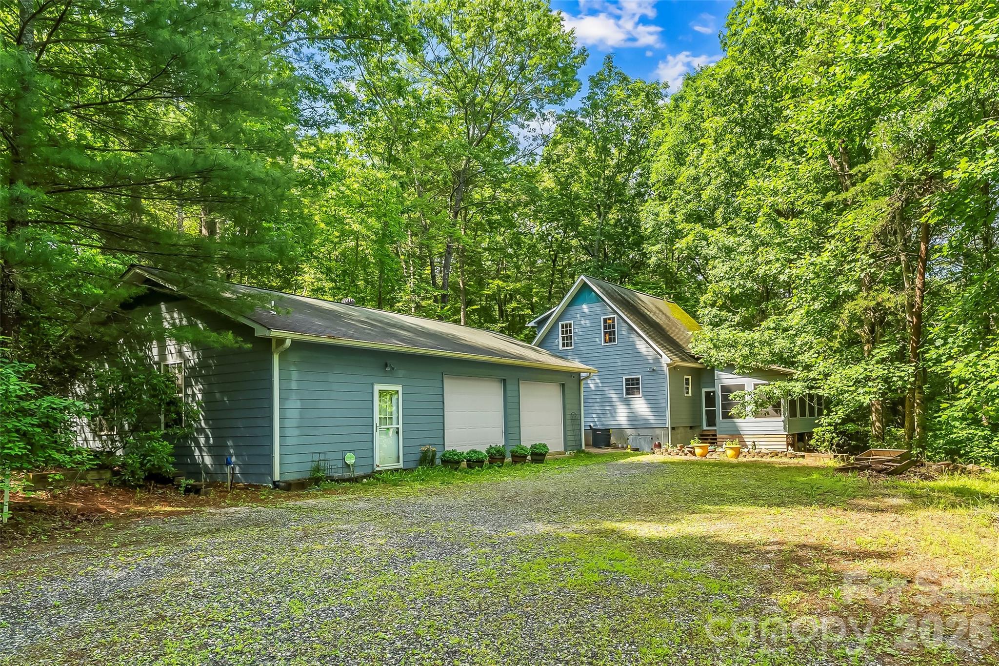 Set on approximately 6.65 acres of pure privacy, this thoughtfully designed retreat offers the perfect blend of comfort, acreage, and mountain-area adventure. With 1,415 heated square feet, this two-bedroom, two-bath with bonus room upstairs home lives effortlessly, surrounded by mature trees, and open sky. Owners have previously used a portion of the property to garden offering sustainability.

Inside, the home features a bright, inviting layout with warm natural light and easy flow between living, dining, and kitchen spaces. Each bedroom offers peaceful views and private access to nature, creating a sense of calm that carries throughout the home.

A standout feature of the property is the 1,188 sq ft garage and workshop — ideal for hobbyists, craftsmen, gear storage, or anyone who needs serious space for projects, vehicles, or equipment. 

Outdoors, the acreage unfolds beautifully, offering room to explore, garden, build, or simply enjoy the serenity of your own mountain haven. Despite the privacy, you’re just minutes from some of Western North Carolina’s most iconic destinations: Lake James, the Fonta Flora Trail, Linville Gorge, Mount Mitchell and nearby ski slopes for year-round recreation.

Whether you’re seeking a primary residence with room to breathe or a private getaway close to world-class outdoor experiences, this property delivers a rare combination of acreage, convenience, and mountain lifestyle.
