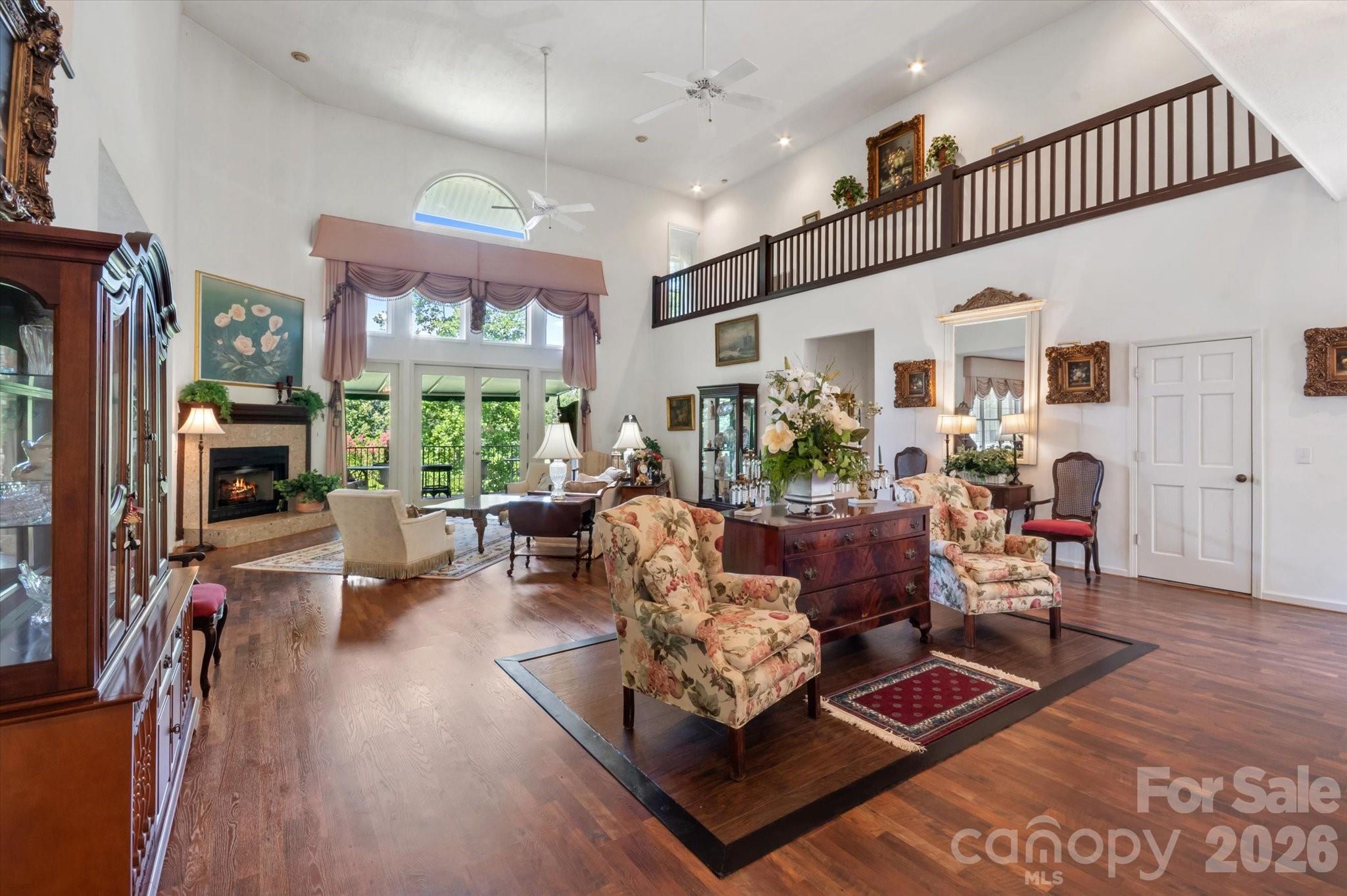 Spread out in style in this 4,560 SQ FT luxury home on a 2+ acre DOUBLE-LOT.  Located in Red Fox neighborhood of Tryon, this stunning home offers a spacious open floor plan, comfortable sun room, and an office fit for the CEO!  If you like walk in closets, ten foot ceilings, and balconies, then THIS IS THE PRIMARY SUITE FOR YOU.  The Grand Salon is exactly that---GRAND.  At over 800 square feet with twenty foot ceilings, it takes your breath away as soon as you pass through the giant, double door entrance and see this magnificent space.  The basement is partially finished with a full bath, and is perfect for a workshop or storage. WHOLE-HOUSE GENERATOR RECENTLY INSTALLED SO YOU NEVER LOSE POWER WHEN YOU NEED IT MOST!!   Come see this remarkable property in person to fully appreciate the value and beauty.  Red Fox is one of the most popular neighborhoods in Polk County, located 10 minutes from Landrum, Tryon, Columbus, and Tryon International Equestrian Center.  25 minutes to DOWNTOWN HENDERSONVILLE.