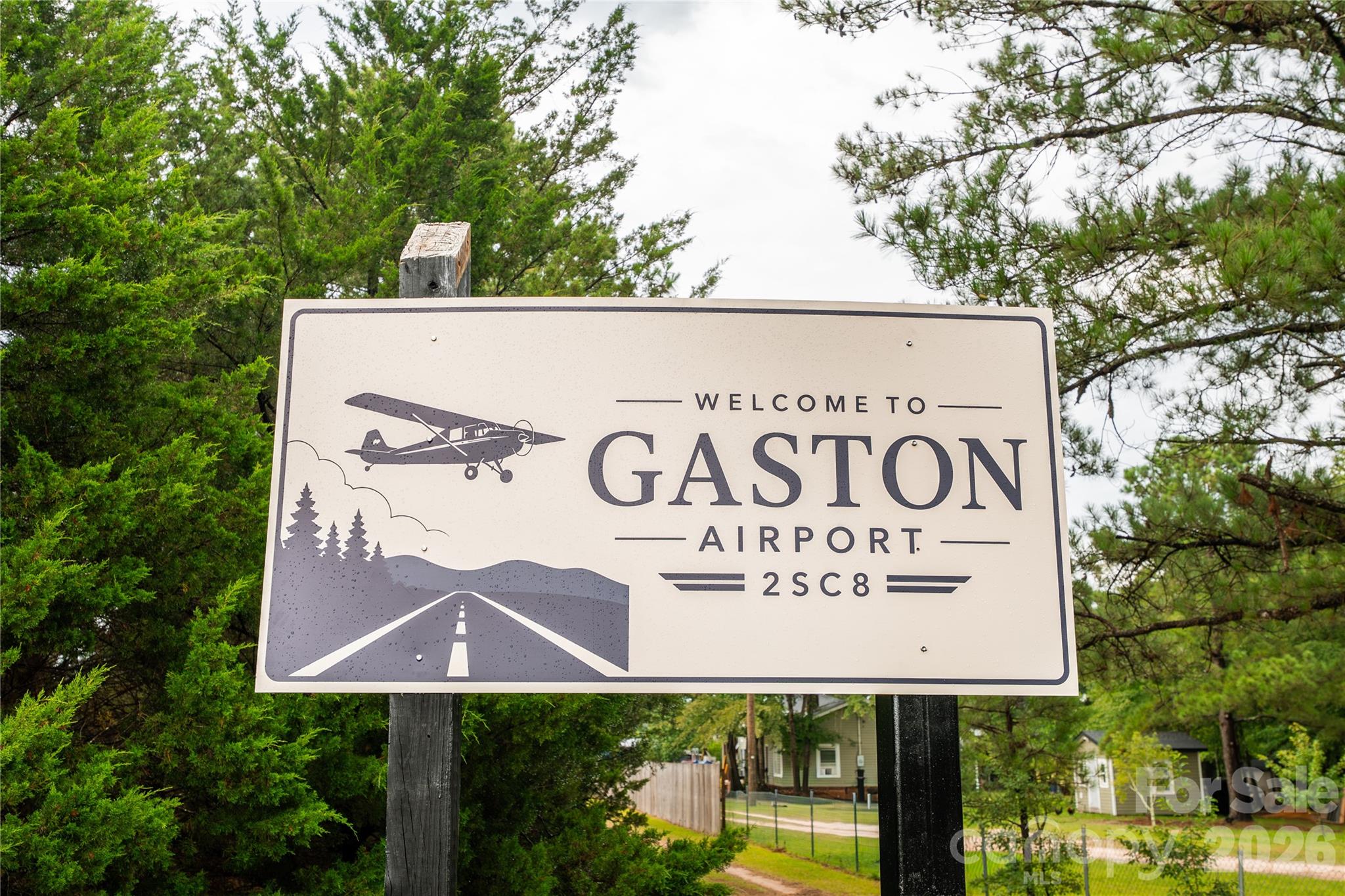 Gaston Airport (2SC8) is a rare opportunity to own a well-established private airfield with excellent aviation infrastructure, expansion potential, and a prime location just minutes south of Columbia, South Carolina. The property spans approximately 18 acres, with about 8.5 acres dedicated to the professionally maintained 3,500’ x 100’ grass runway. The runway offers clear approaches, excellent drainage, and smooth operations, and has reliably supported aircraft up to the size of a King Air 90. Routine mowing is easily handled with the on-site 72" zero-turn mower that conveys with the property.

The airport includes a 5,600+ sq ft hangar constructed of metal and wood on a concrete floor. The hangar features a large 45' hydraulic door, bathroom, fluorescent lighting, and recent upgrades including new electrical wiring, replaced water lines, and fresh exterior paint. It currently houses approximately six aircraft, with continued demand from pilots seeking storage or private hangar space in the area.

Utility infrastructure includes public electricity, a deep water well, and a septic system, providing reliable support for current operations and future development. The property is zoned to allow residential construction and multiple structures, offering excellent potential for private homes, additional hangars, or aviation-related facilities. Open acreage surrounding the runway and hangar provides ideal sites for expansion.

Gaston Airport is positioned along the southern edge of Columbia Class C airspace, offering an optimal blend of accessibility and privacy. Its central location places it within a two-hour drive of Charlotte, Charleston, Augusta, and numerous regional destinations, making it an attractive option for pilots seeking a private airfield with strong regional connectivity.

With its long, well-maintained runway, substantial hangar, reliable utilities, and room to grow, Gaston Airport represents an exceptional aviation property and a rare opportunity for buyers seeking a private airfield in the eastern states.