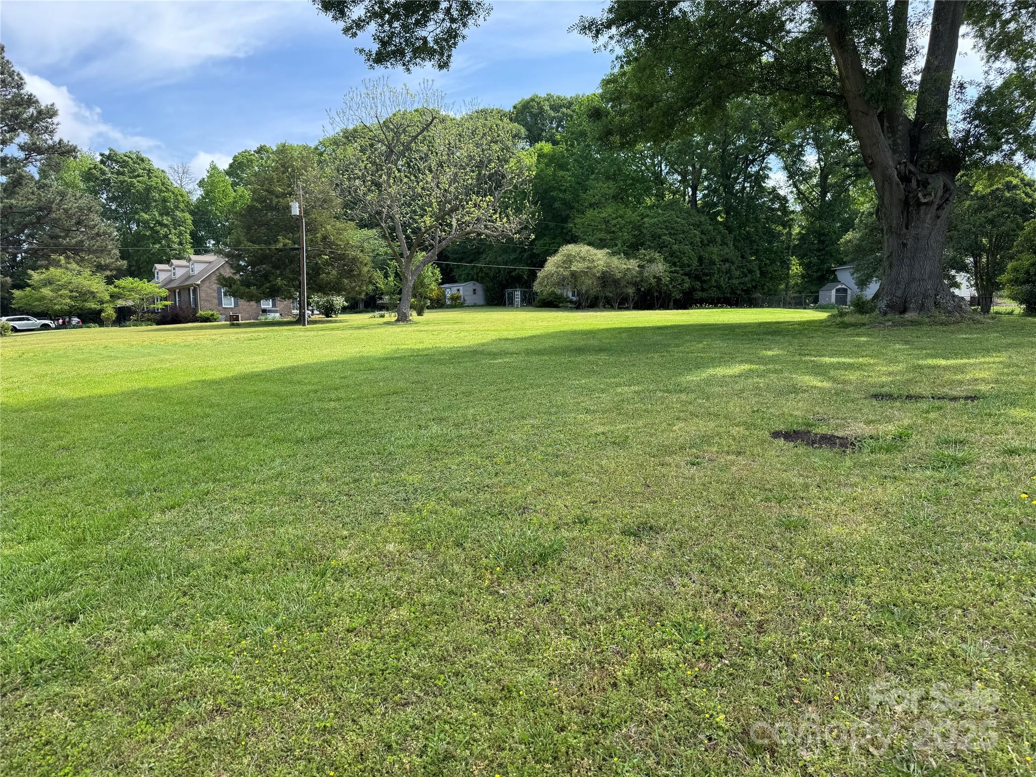 FORT MILL near downtown! Level, Cleared lot .765 acre & Ready to Build.  NO HOA.  Enjoy Anne Springs Close Greenway just down the street, Elisha Park is 2 minutes away at the south end of Old Nation Rd. with an 
Amphitheater, walking trail & playground. The historic Dairy Barn at Anne Springs Close Greenway is at the other end of Old Nation Rd.  Stroll down Main Street & enjoy Fort Mill's shops, restaurants & more. Fort Mill Schools! Sewer and water taps needed. Build set back 50' frontage, 10 side, 25 rear.