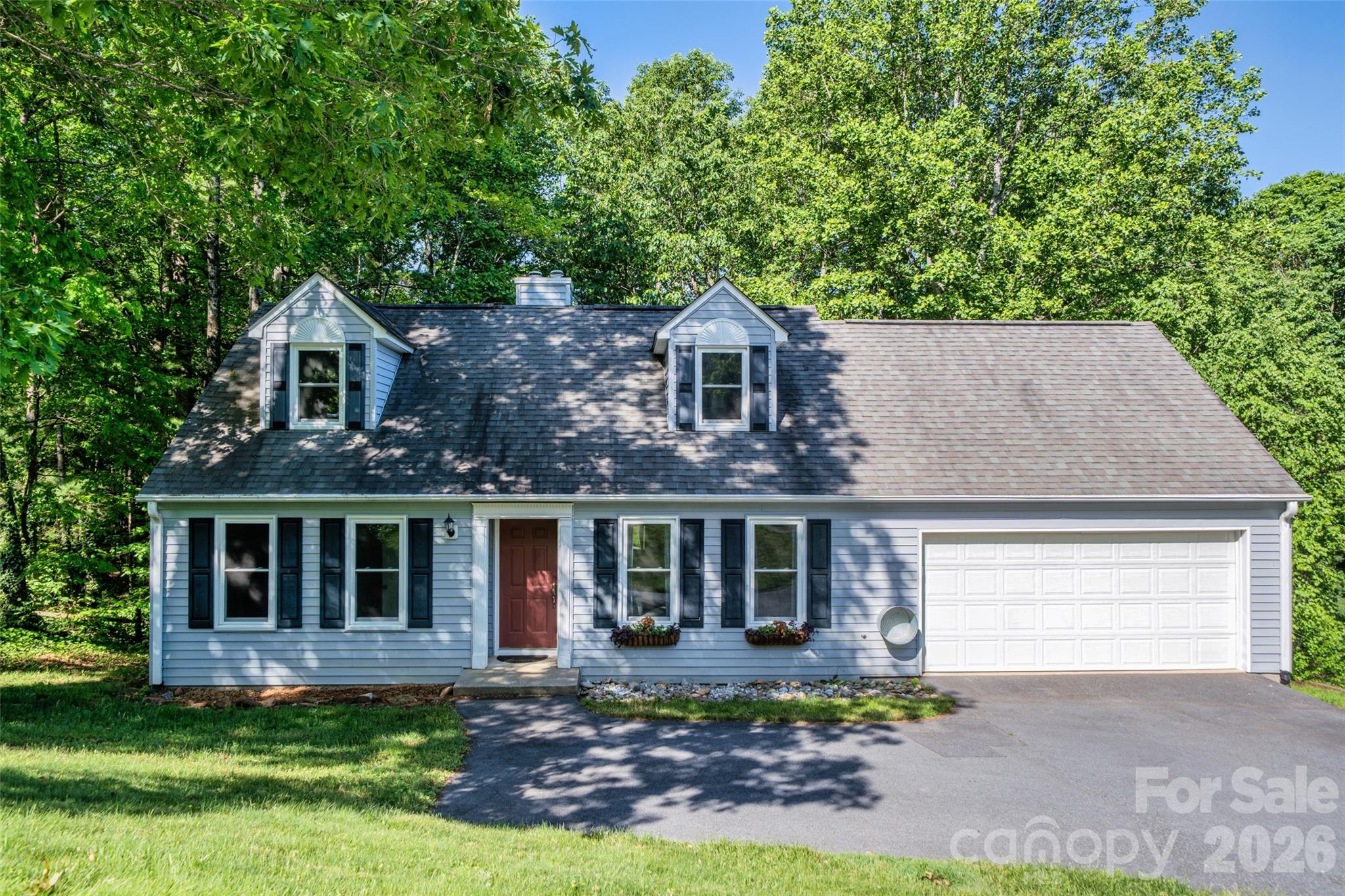 This comfortable home offers a practical layout with plenty of room to spread out. The primary bedroom and bathroom are conveniently located on the main level, along with the laundry room and a half bath for guests. Upstairs, you’ll find the additional bedrooms and a flexible bonus room that works great as a playroom or home office. 

The kitchen is ready for everyday cooking with a gas range and newer appliances. The home has been updated with fresh paint, new windows throughout and a new sliding glass door that lets in plenty of light. If you like being outdoors, the large back deck is perfect for weekend BBQs or just relaxing. It overlooks a private backyard that borders quiet woods, so you don't have to worry about rear neighbors. Plus, the garage refrigerator stays with the home!

Location makes this home an easy choice! Only 10-15 minutes to downtown Hendersonville, 25 minutes to the Airport, 40 minues to downtown Asheville and 45 minutes to downtown Greenville.