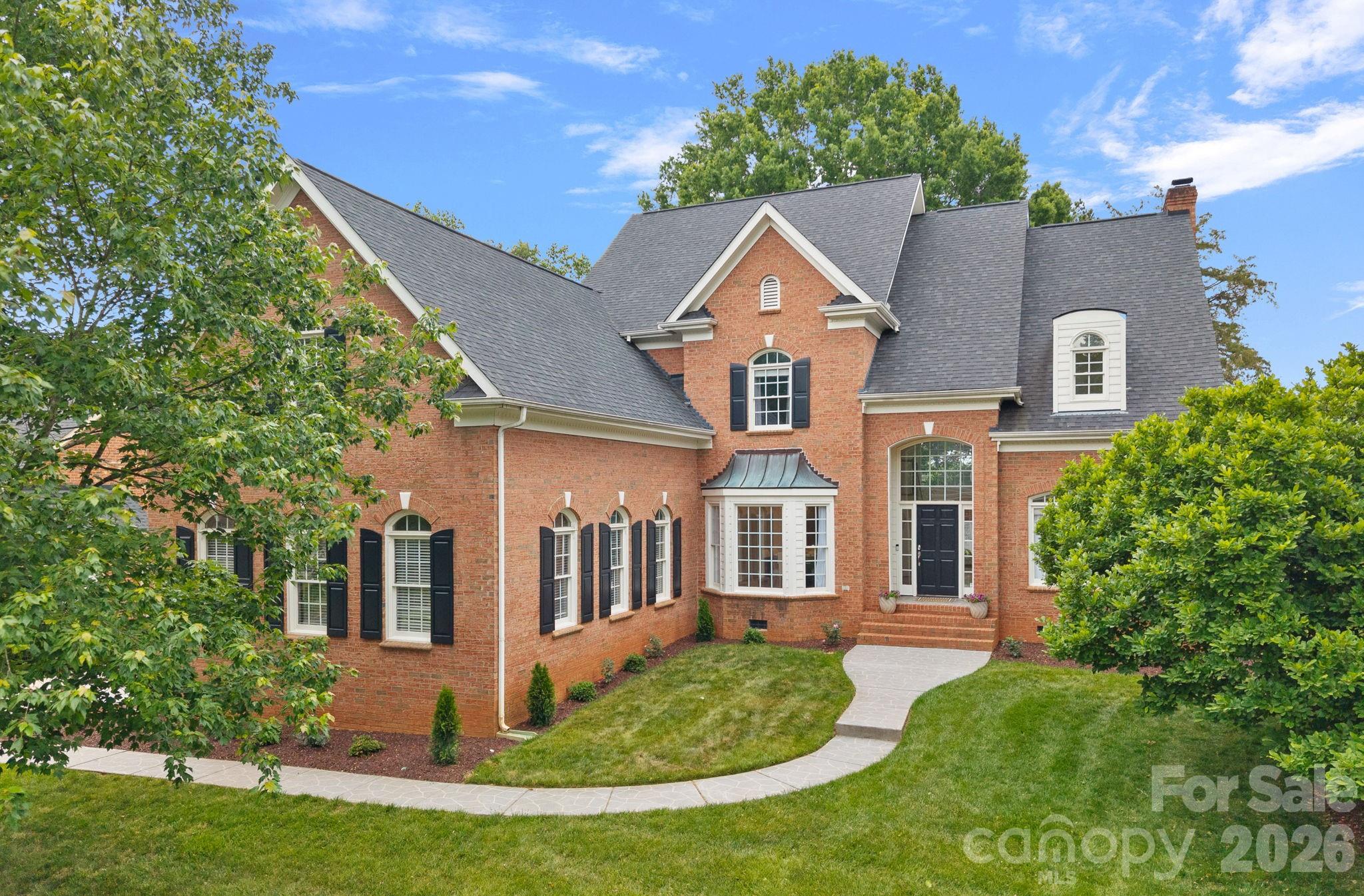 HUGE PRICE ADJUSTMENT – SELLER SAYS BRING AN OFFER! Rare opportunity to own one of Birkdale's larger floorplans for under $1 million. Enjoy spacious living, a premier location, and exceptional value in one of the area's most sought-after communities. Don't miss your chance to secure this home at a newly reduced price! Nestled on a quiet cul-de-sac street along the 17th hole of Birkdale Golf Course, this full-brick home offers an exceptional blend of comfort, and prime location just under a mile from Birkdale Village with easy access to shopping, dining, and entertainment. A stamped concrete walkway leads you into a thoughtfully designed interior filled with natural light. Floor-to-ceiling windows and doors create a seamless connection to the outdoors while showcasing stunning sunrise views over the golf course. The main level features a spacious primary suite complete with a beautifully updated spa-like bathroom and walk-in closet. A versatile office with vaulted ceilings provides the perfect work-from-home space, while the convenient main-level laundry room adds everyday ease. The dual staircase enhances both functionality and architectural appeal. The recently updated kitchen is designed to impress, featuring quartz countertops, a stylish tile backsplash, and range. The upper-level features 3 additional bedrooms, 2 full bathrooms, and a bonus room or optional 5th bedroom. Throughout the home, you’ll find updated lighting, built-in cabinetry, and abundant walk-in storage. Step outside to your private outdoor retreat, set on a picturesque golf course lot surrounded by mature oak trees and lush landscaping. The expansive deck is ideal for relaxing or entertaining while enjoying peaceful views of the grassy yard and fairway. Perfectly positioned near Lake Norman, Blythe Landing, and I-77, this home combines serene living with unbeatable convenience.