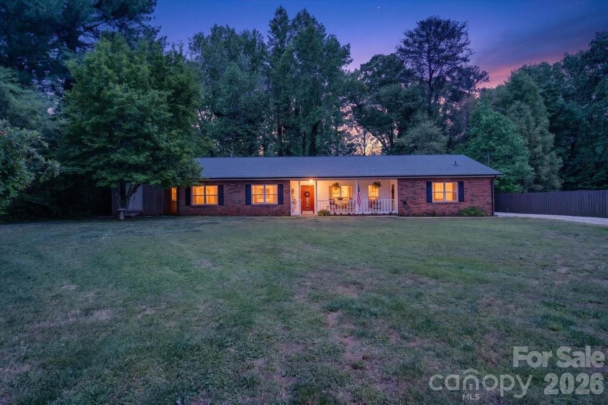 Reduced Price to put this one out front for you! Under $400k for this charming home in a fantastic location?!  Perfection!  This immaculate home is ready for you to move in right away, sitting on almost 3/4 of an acre of land, with a large front and back yard with peeks of views to Lake Norman out back this is a relaxing country lifestyle home with NO HOA and fatastic access to everything you need for shopping and food in Sherrills Ford and Denver, extremely easy and close access to Hwy150 into Mooresville and Linconton, close commutes to the local schools of Bandys High School, Mill Creek Middle and Sherrills Ford Elementary too! This full brick ranch was built with pride by the sellers and has been maitained with true pride of ownership and detail that shows throughout the property.