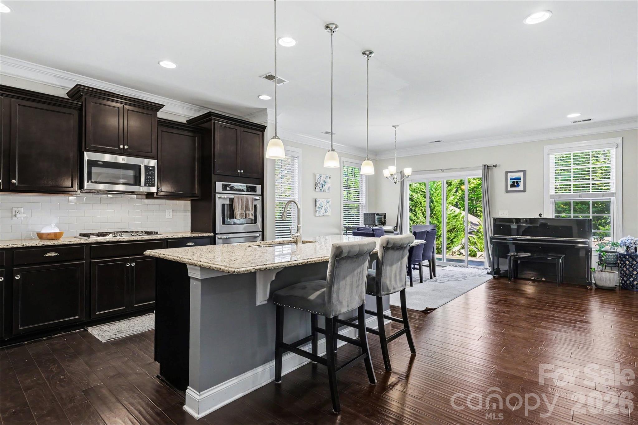 Welcome to this stunning home in the highly sought-after Fort Mill area! Offering over 3,100 square feet, this spacious 4-bedroom, 3-bath home combines modern design with everyday functionality.

The open-concept main level features a beautifully appointed kitchen with granite countertops, stainless steel appliances, and a butler’s pantry—perfect for entertaining. The inviting living space is anchored by a cozy gas fireplace and enhanced with recessed lighting throughout. A main-level bedroom provides flexibility for guests or a home office.

Upstairs, you’ll find a large bonus room ideal for a media space or playroom, along with a convenient upper-level laundry room. The primary suite offers a private retreat complete with a makeup vanity and ample space to unwind.

Additional highlights include a functional mudroom and a layout designed for comfortable living. Built in 2017 and meticulously maintained, this home feels like new.

Located in a community served by the top-performing Fort Mill School District—consistently ranked among the best in the state for academic performance —this home offers both quality and convenience.

Don’t miss your opportunity to own in one of the Charlotte area’s most desirable locations!