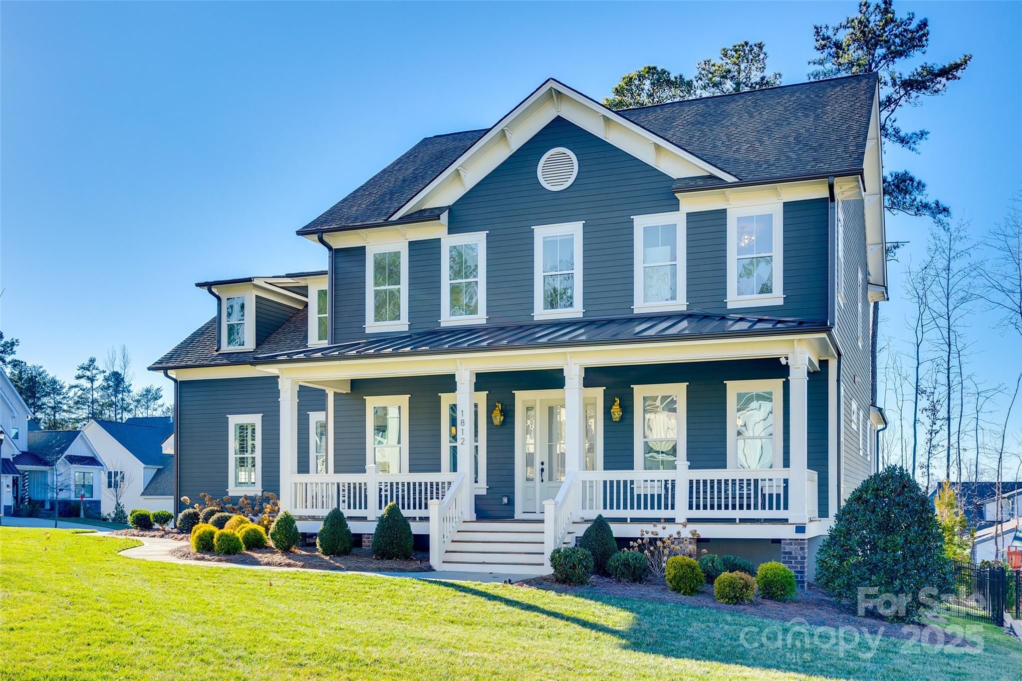 This stunning corner-lot home on a cul-de-sac showcases impeccable design inside and out. A rocking chair front porch and screened-in back porch create inviting outdoor spaces. The chef’s kitchen boasts a waterfall quartz island, brushed gold finishes, a farmhouse sink, GE Monogram appliances, a gas range with double ovens, stacked cabinets, and a chimney hood. Custom cabinetry and detailed moulding elevate the interior, complemented by real hardwood floors throughout the first floor, stairs, upstairs hall, primary suite, and bonus room. The primary suite offers a tray ceiling, custom walk-in closet, and spa-like bath with a standalone tub, dual vanities, quartz countertops, and a tiled walk-in shower. Upstairs are four bedrooms, including one with a Jack-and-Jill bath, a large bonus room, and a spacious laundry room. Additional highlights include motorized shades, plantation shutters, a three-car garage, whole-house water filtration, and an encapsulated crawl space.