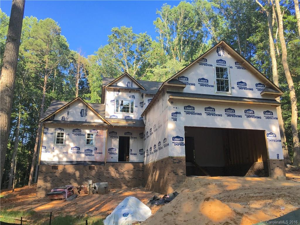 Looking for a private New Home that sits back in the woods on a 3 acre corner in a great established neighborhood, home under construction and its a great deal on 3 acres in Clover School district. If you hurry you can choose your own colors and floor coverings, lighting, appliances. 3 bedrooms with master on main, bonus room over 2 car garage and add'l bonus/ loft. Ceramic tile in baths and kitchen! Granite counters in kitchen, HDWDS in foyer, Great room and dining room.