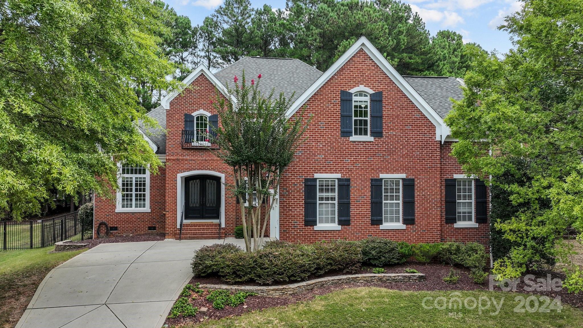 Welcome to this exceptional 5-bedroom, 3-bathroom home in the Turtle Point section of the Palisades! This all brick beauty greets you in the 2 story foyer & living room through custom double doors. The downstairs flows through the dining room into the open concept kitchen & great room. The STUNNING Brazilian tigerwood hardwoods on the 1st floor add to the elegant, warm feeling of the home. The kitchen features a large island, double oven, gas cooktop & walk-in pantry. Natural light fills the sun room & great room, with gas fireplace adding to the ambience.   Enjoy the fenced backyard with extensive patio, deck, fire pit & terraced landscaping. Upstairs is the elegant primary with ensuite bathroom & 2 closets. The 5th bedroom can be used as a large bonus room. An oversized garage allows for extra storage. All of this nestled in the Palisades community with amazing amenities, including nature trails, outdoor pool, clubhouse, fitness center, sports courts & playground. Come tour today!